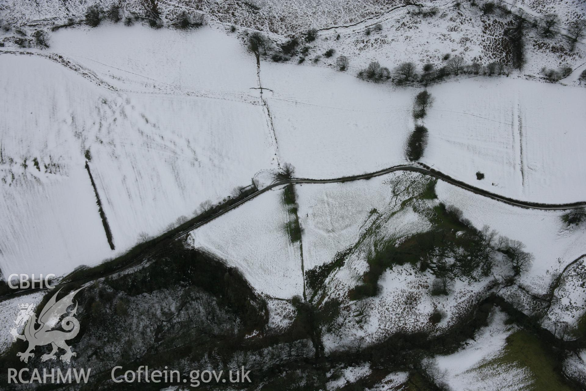 RCAHMW colour oblique aerial photograph of former trackways alongside lane Cwm Pennant. Taken on 06 March 2006 by Toby Driver