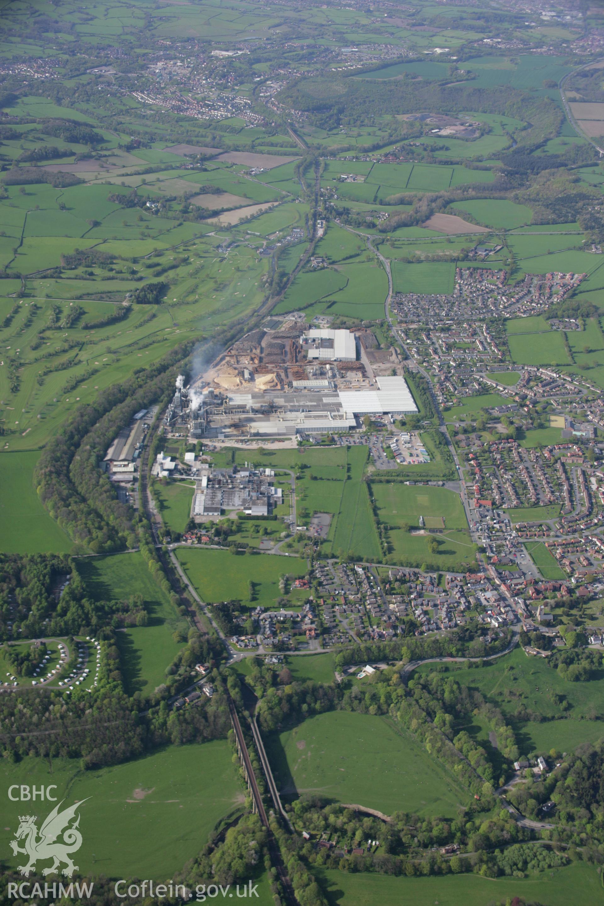 RCAHMW digital colour oblique photograph of the woodchip factory in Chirk from the south. Taken on 05/05/2006 by T.G. Driver.