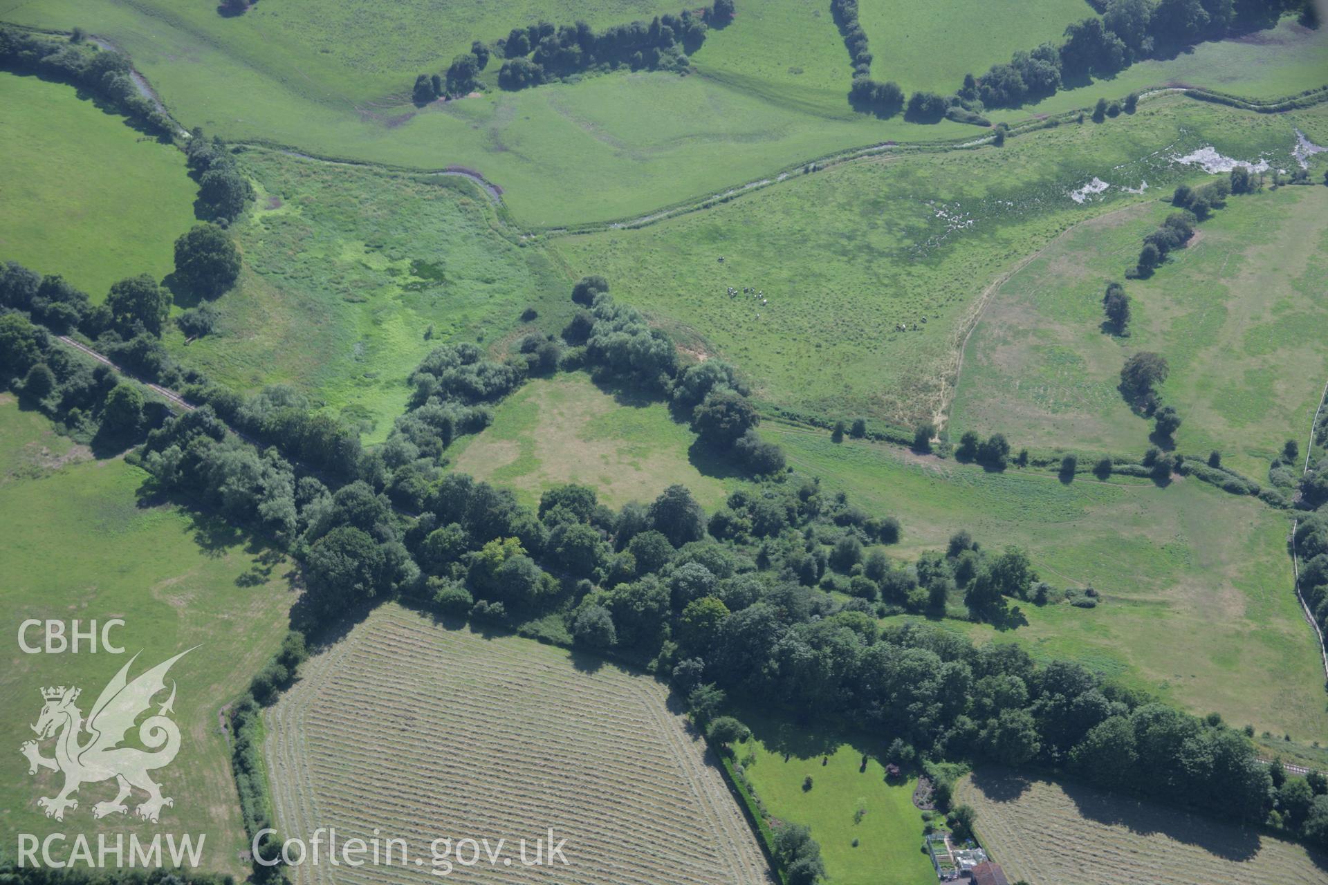 RCAHMW colour oblique aerial photograph of The Berries Earthwork Castle. Taken on 13 July 2006 by Toby Driver.