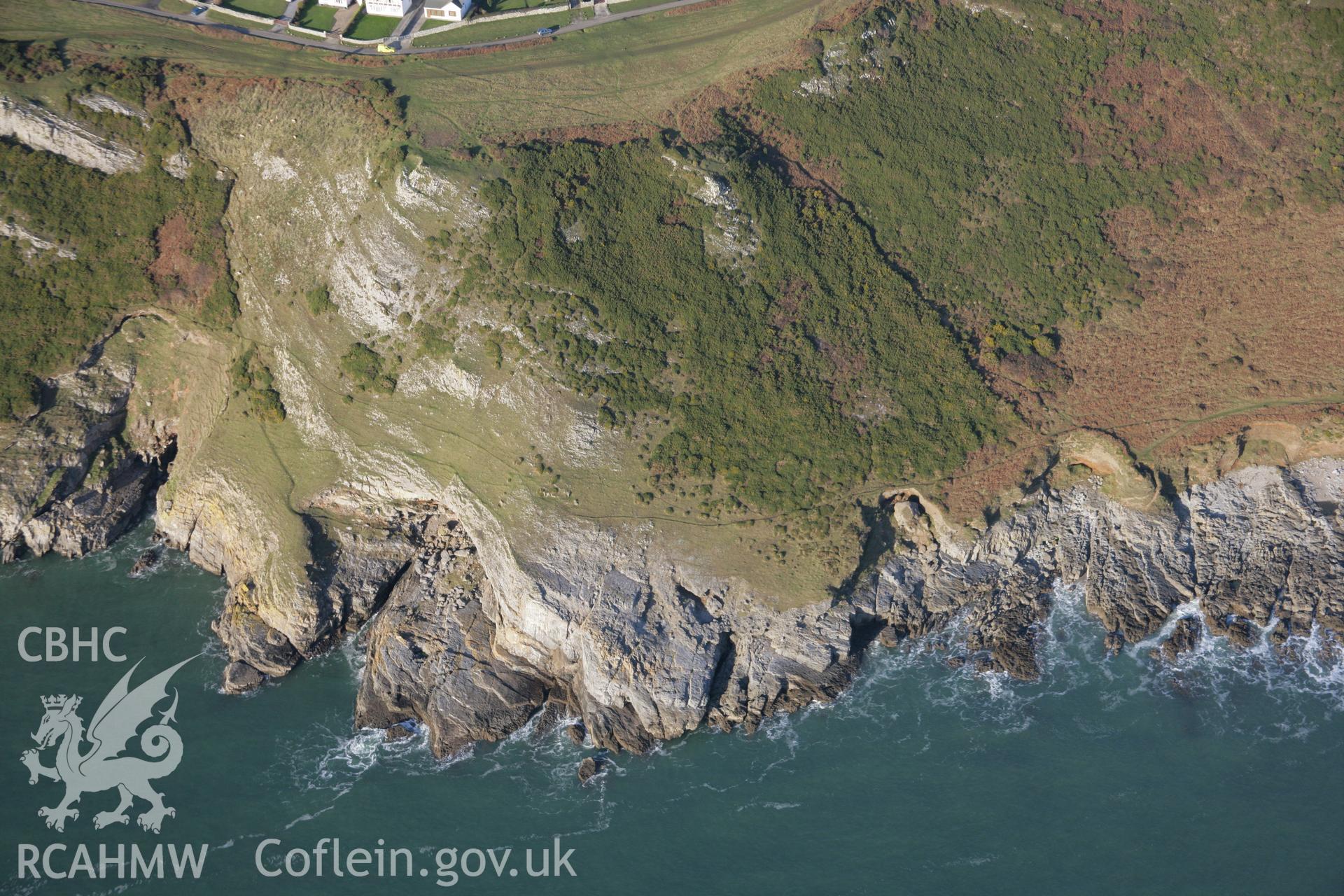 RCAHMW colour oblique aerial photograph of Bacon Hole Cave from the south. Taken on 26 January 2006 by Toby Driver.