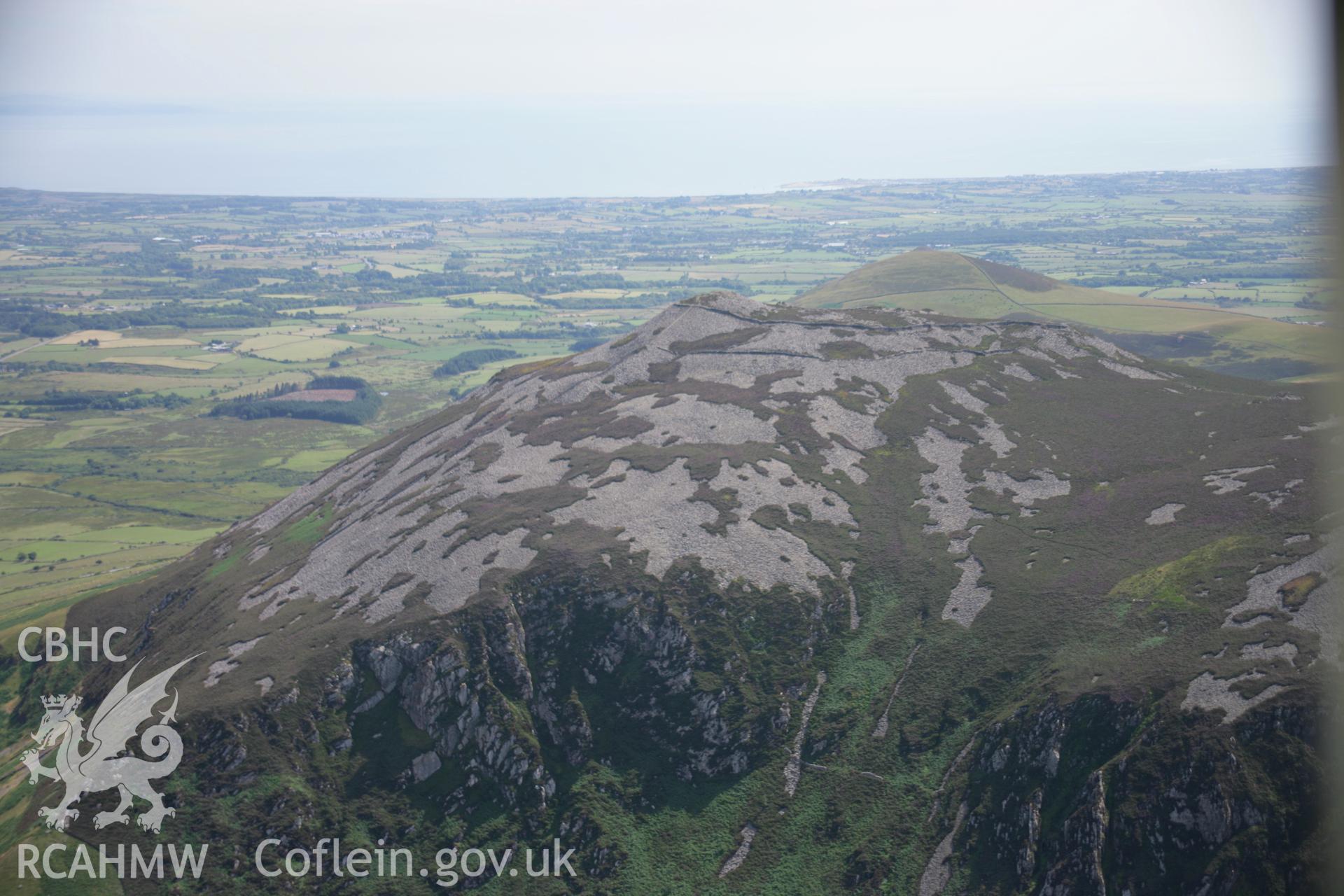 RCAHMW colour oblique aerial photograph of Tre'r Ceiri Fort, Llanaelhaearn. Taken on 25 July 2006 by Toby Driver.