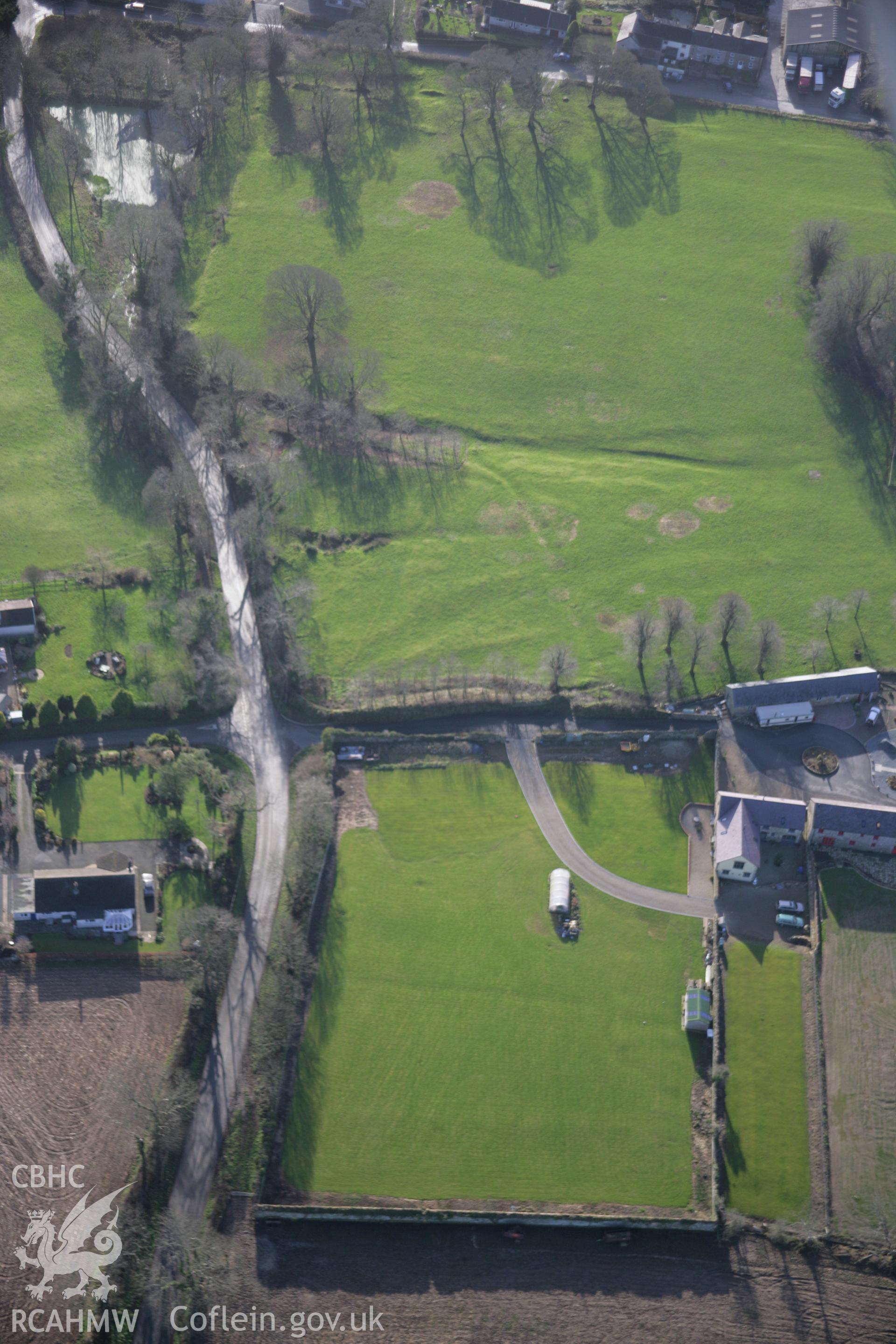 RCAHMW colour oblique aerial photograph of Wiston Castle from the north showing the earthworks of trackways to the east. Taken on 11 January 2006 by Toby Driver.