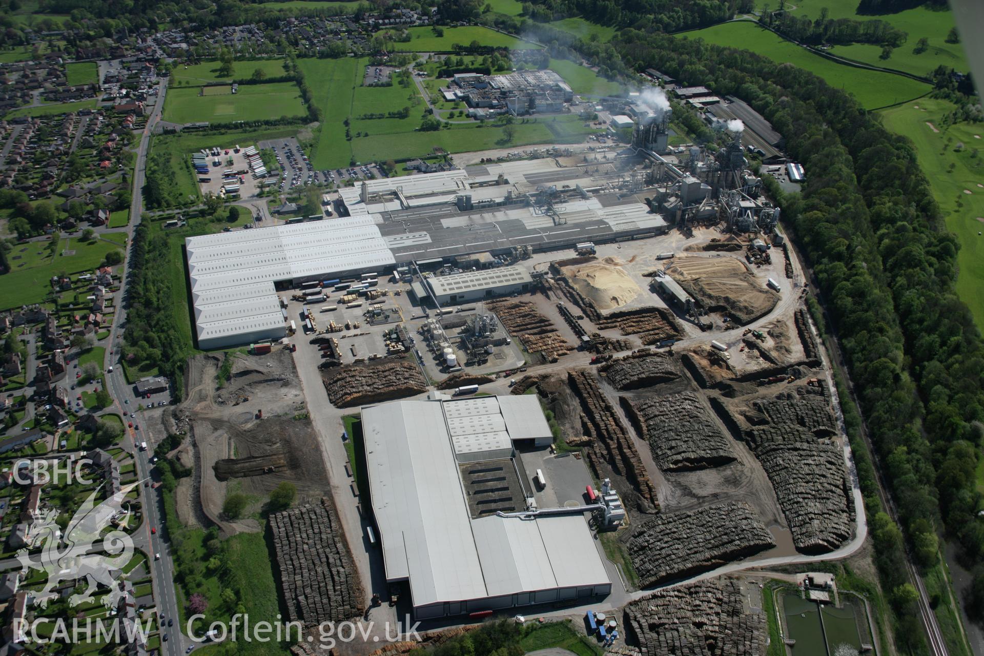 RCAHMW digital colour oblique photograph of the woodchip factory in Chirk from the north. Taken on 05/05/2006 by T.G. Driver.