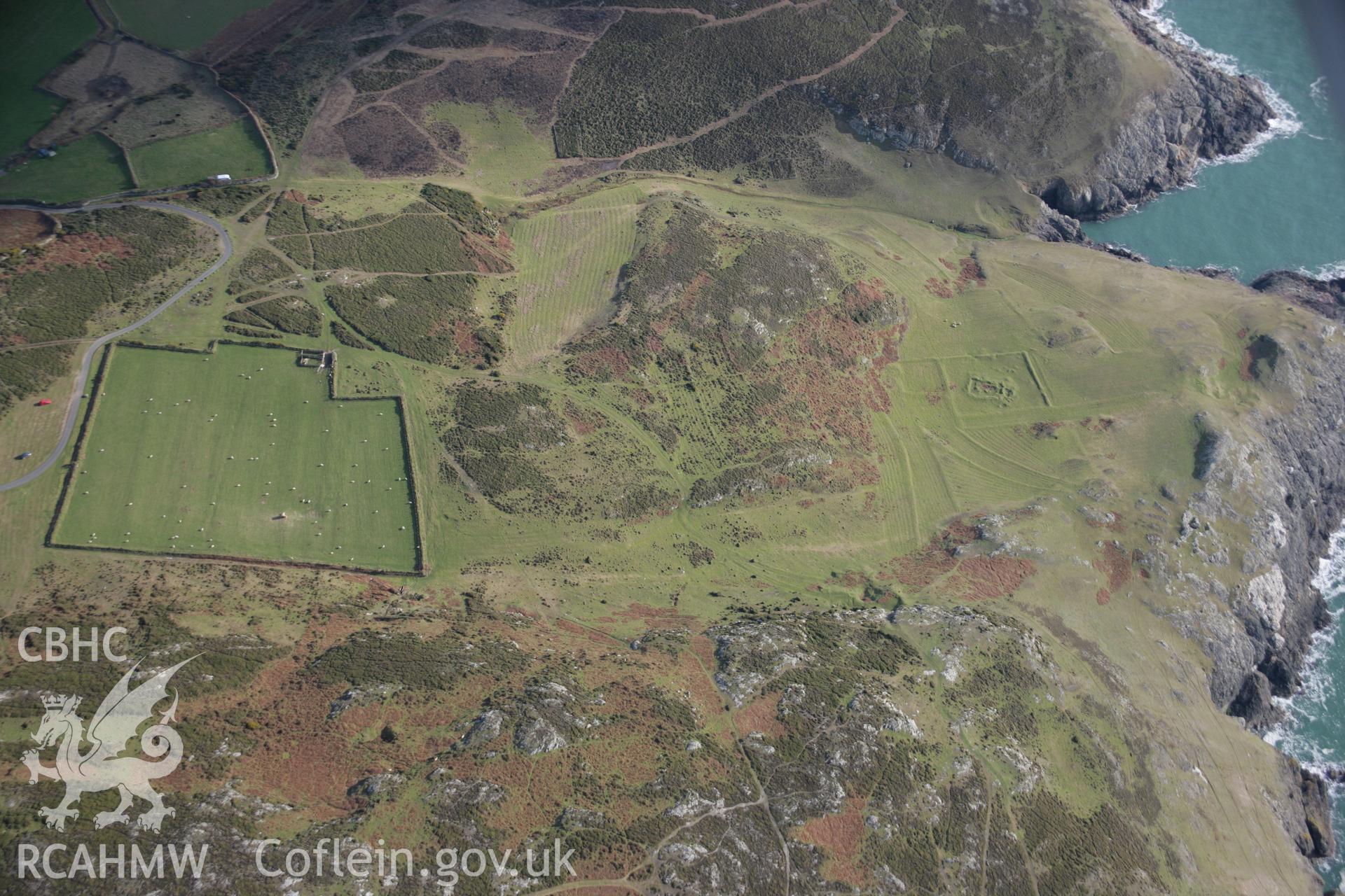 RCAHMW colour oblique aerial photograph of St Marys Church earthworks, viewed from the north-west. Taken on 09 February 2006 by Toby Driver