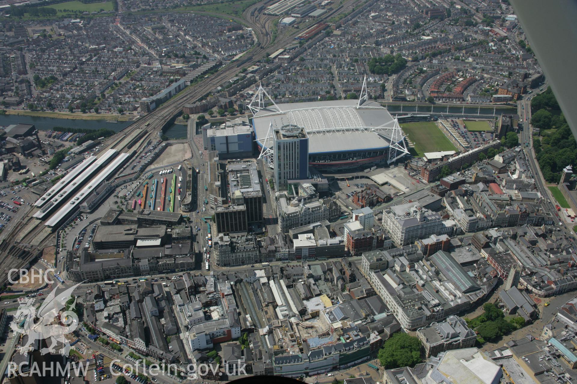 RCAHMW colour oblique photograph of Cardiff city centre and Millennium Stadium. Taken by Toby Driver on 29/06/2006.