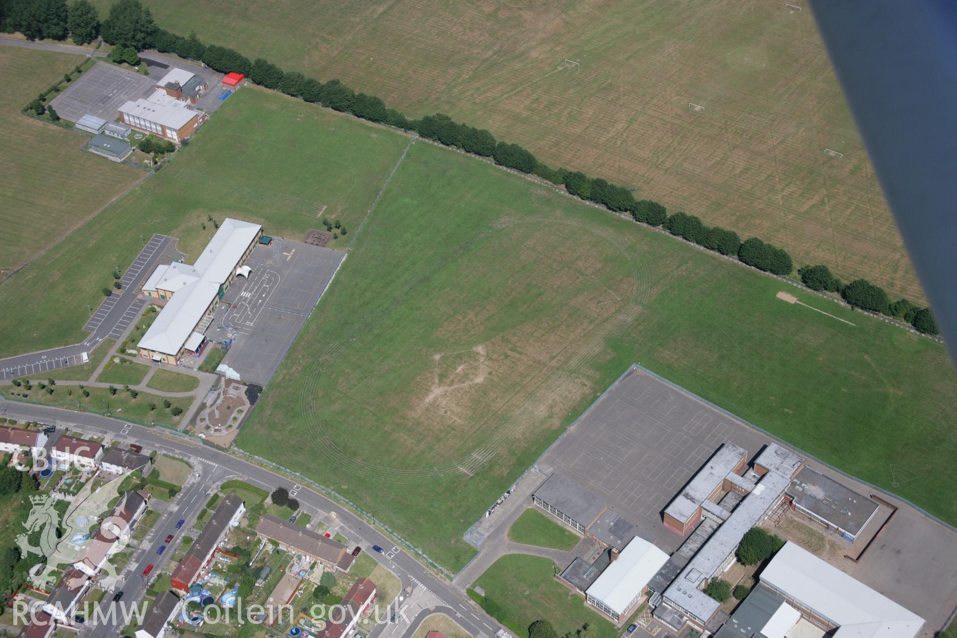 RCAHMW colour oblique aerial photograph of school near Ely Roman Villa. Taken on 24 July 2006 by Toby Driver