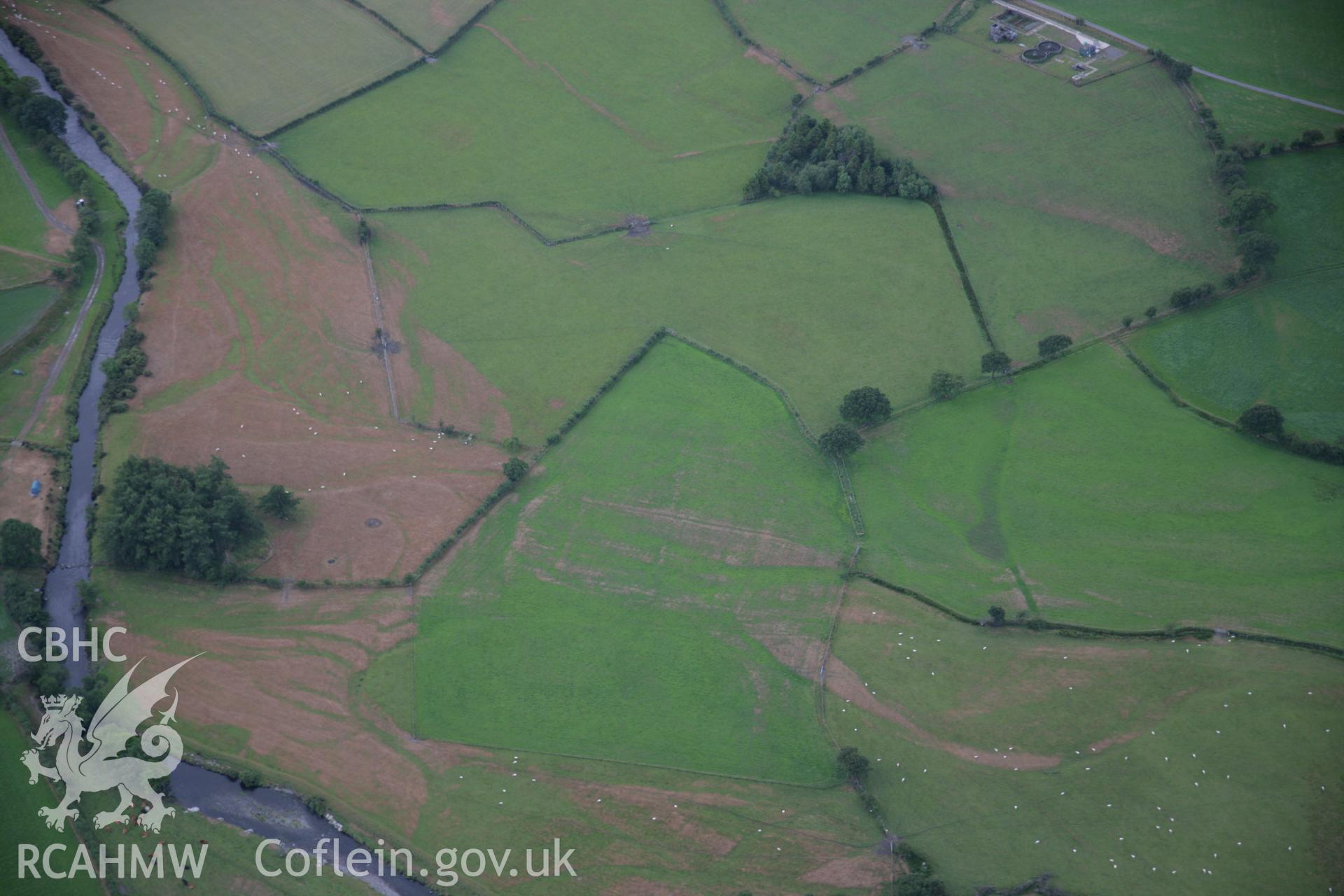 RCAHMW colour oblique aerial photograph of parchmarks west of Dolfawr. Taken on 31 July 2006 by Toby Driver.