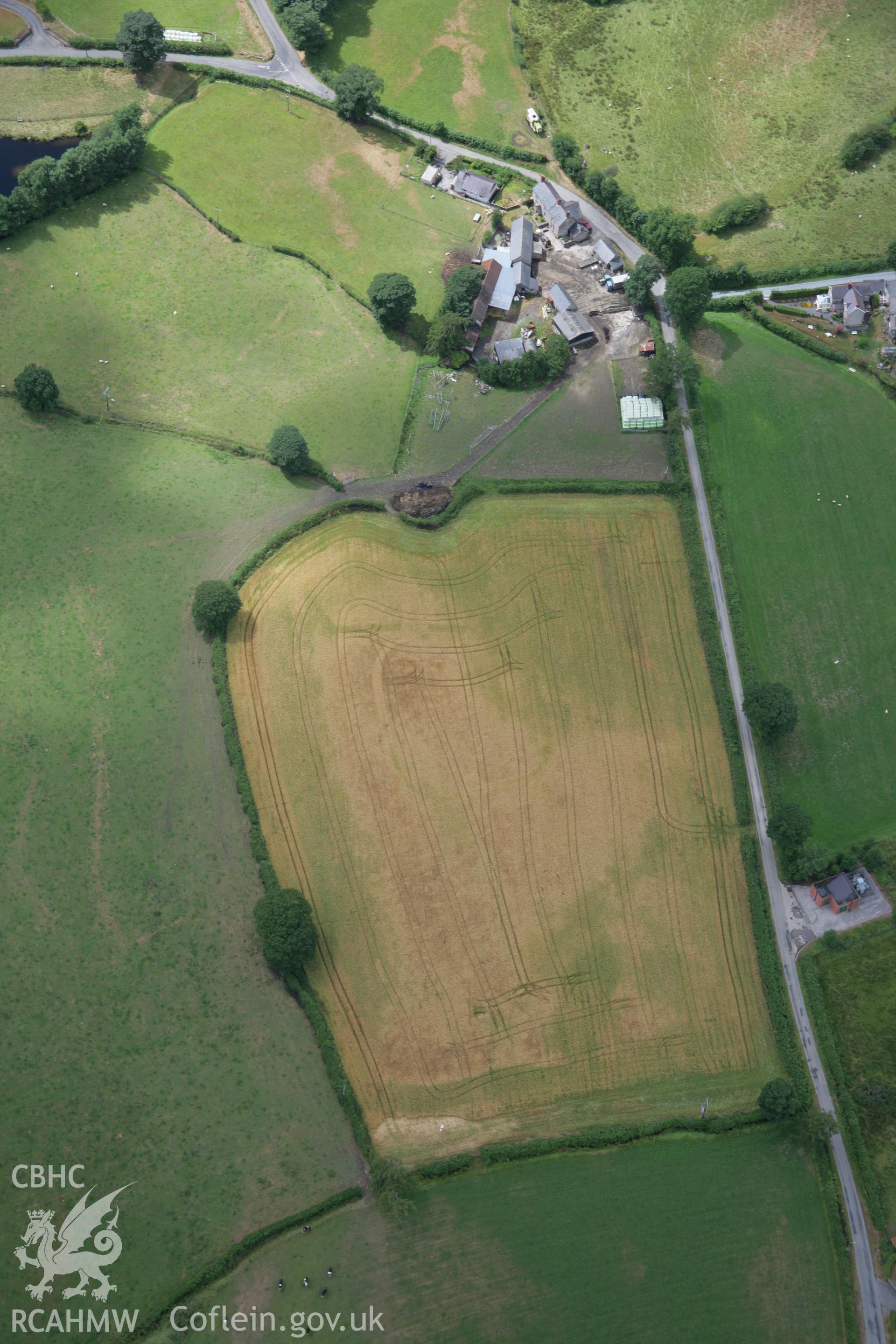 RCAHMW colour oblique aerial photograph of defended enclosure at Llawr-y-Bettws. Taken on 31 July 2006 by Toby Driver.