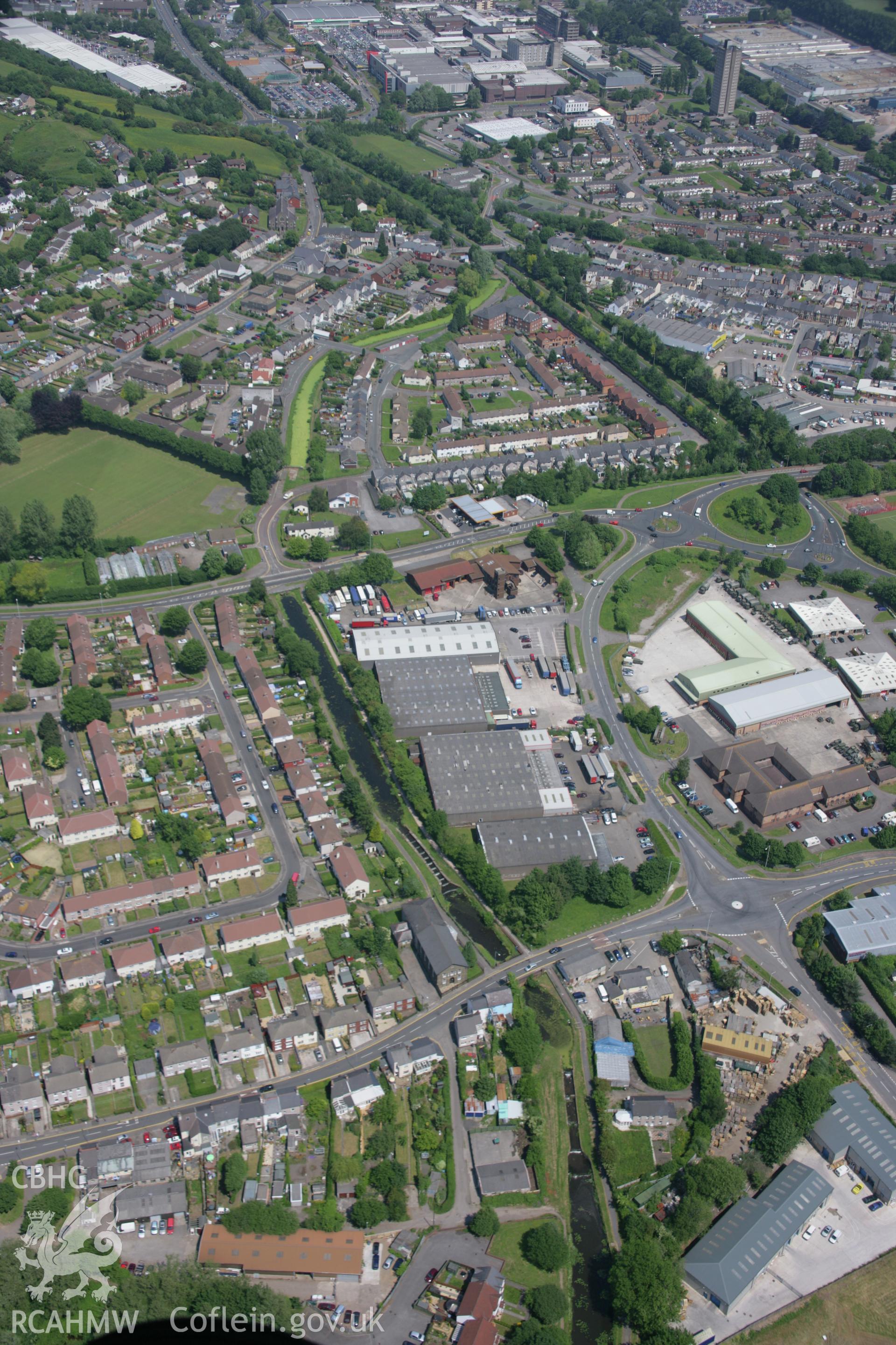 RCAHMW colour oblique aerial photograph of the Monmouthshire and Brecon Canal at Cwmbran from the south. Taken on 09 June 2006 by Toby Driver.
