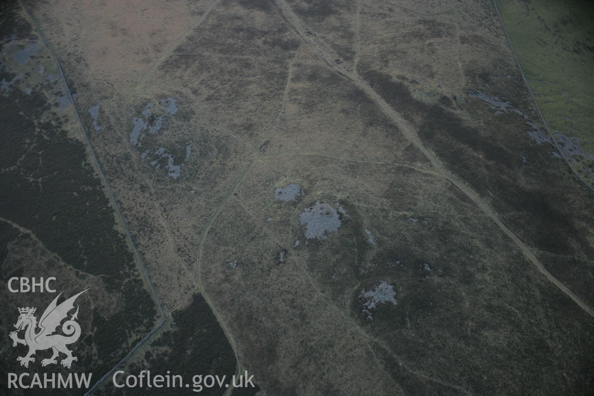 RCAHMW colour oblique aerial photograph of Mynydd Rhiw Cairn I, viewed from the south-east. Taken on 09 February 2006 by Toby Driver.