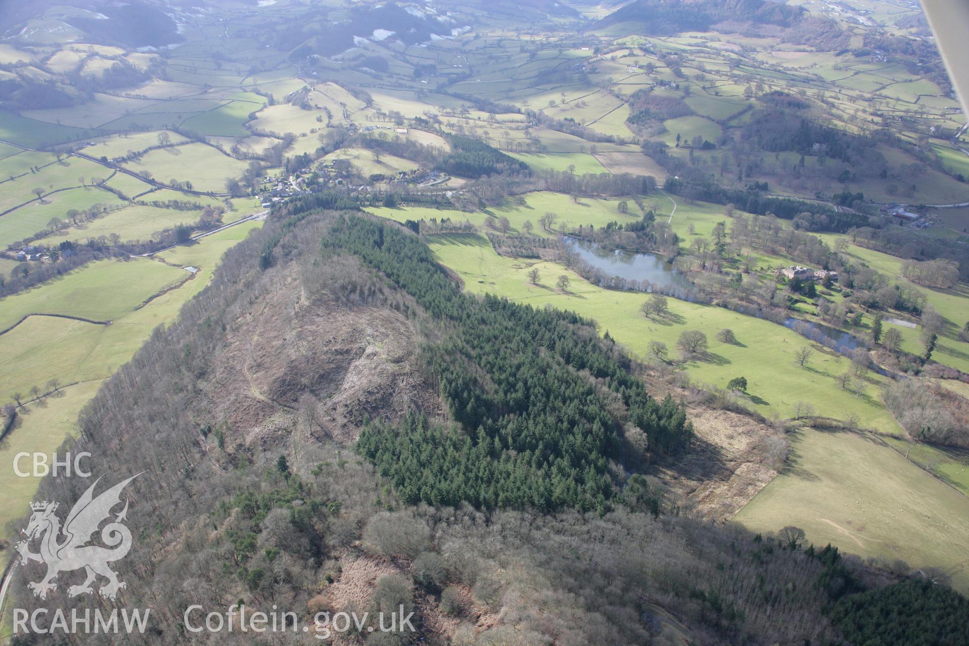 RCAHMW colour oblique aerial photograph of Bryngwyn Wood hillfort, viewed from the north-east. Taken on 06 March 2006 by Toby Driver