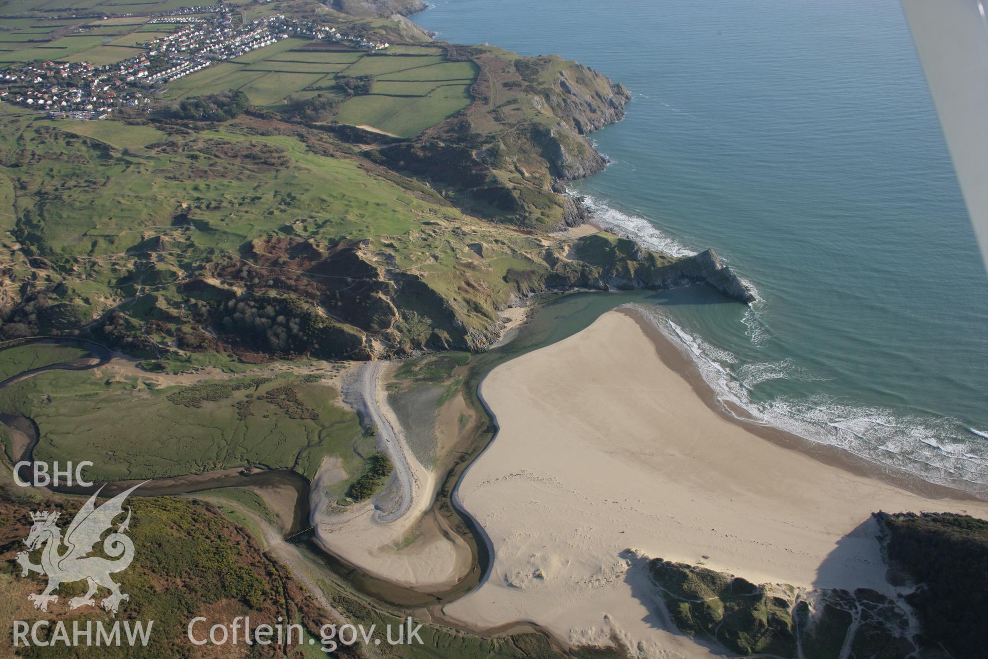 RCAHMW colour oblique aerial photograph of Three Cliffs Bay from the north-west. Taken on 26 January 2006 by Toby Driver.
