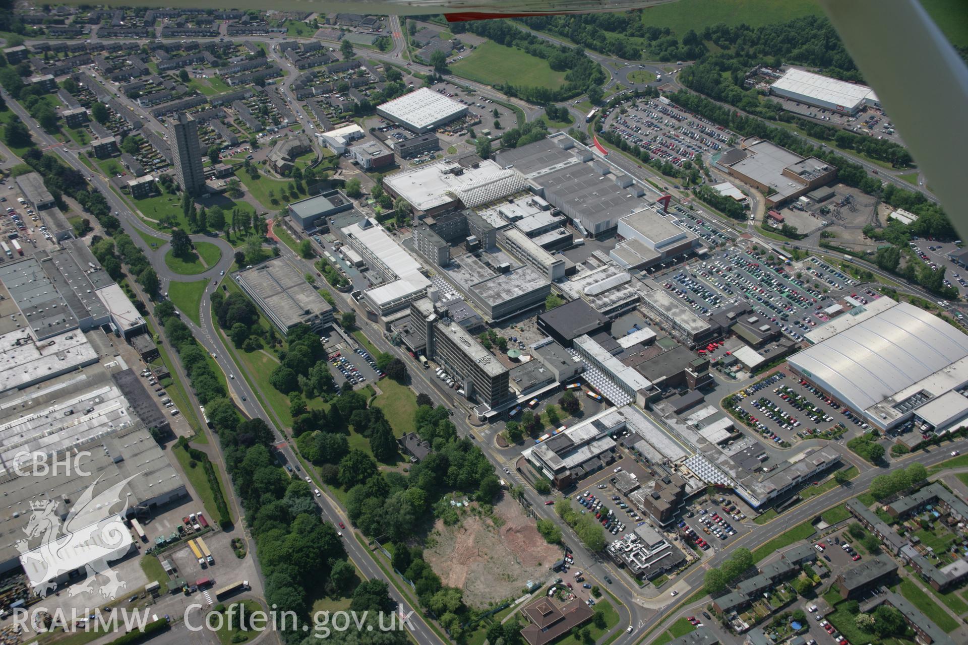 RCAHMW colour oblique aerial photograph of Cwmbran Shopping Centre from the north. Taken on 09 June 2006 by Toby Driver.