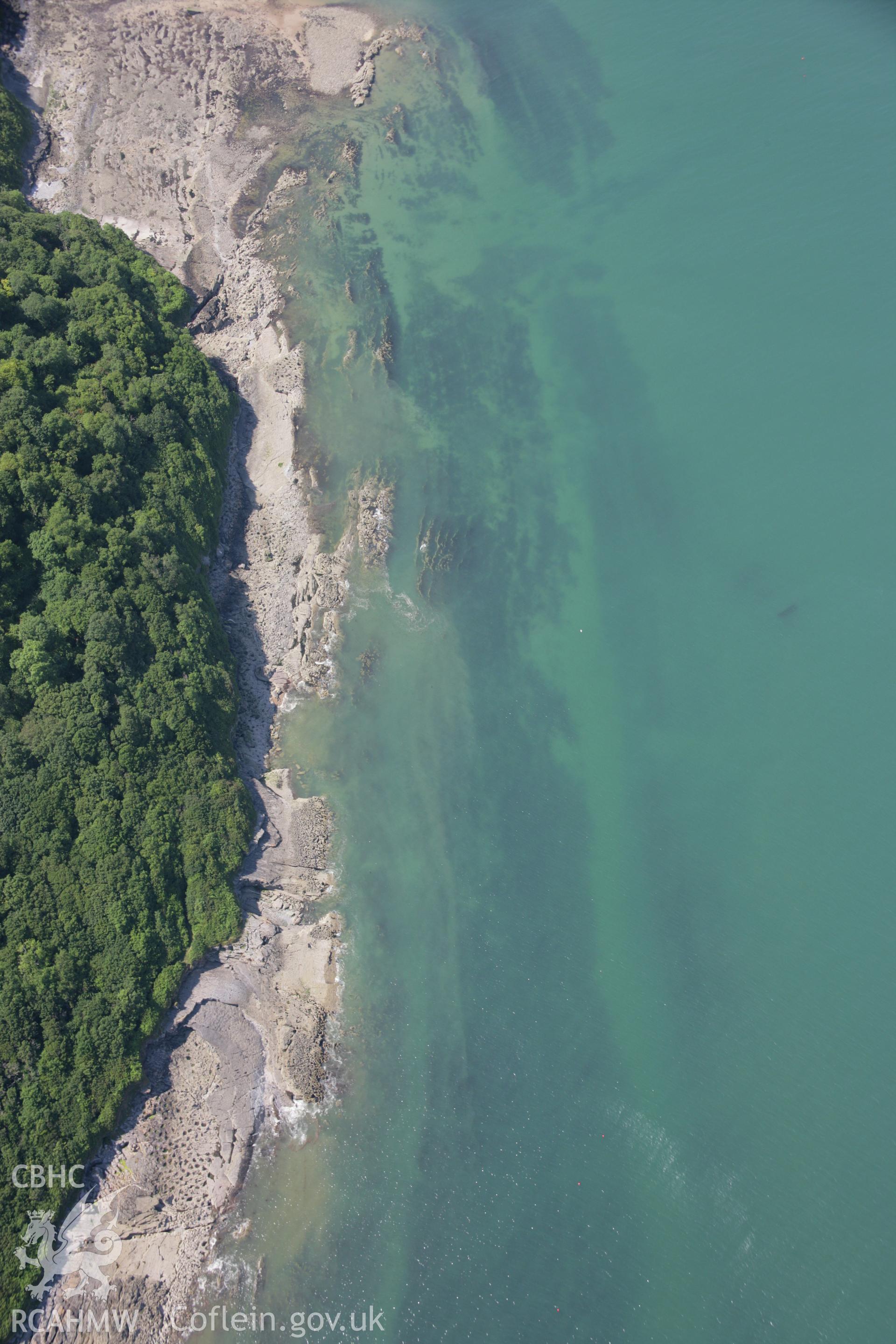 RCAHMW colour oblique aerial photograph of showing Fish Traps on coast near Oxwich Bay. Taken on 11 July 2006 by Toby Driver.