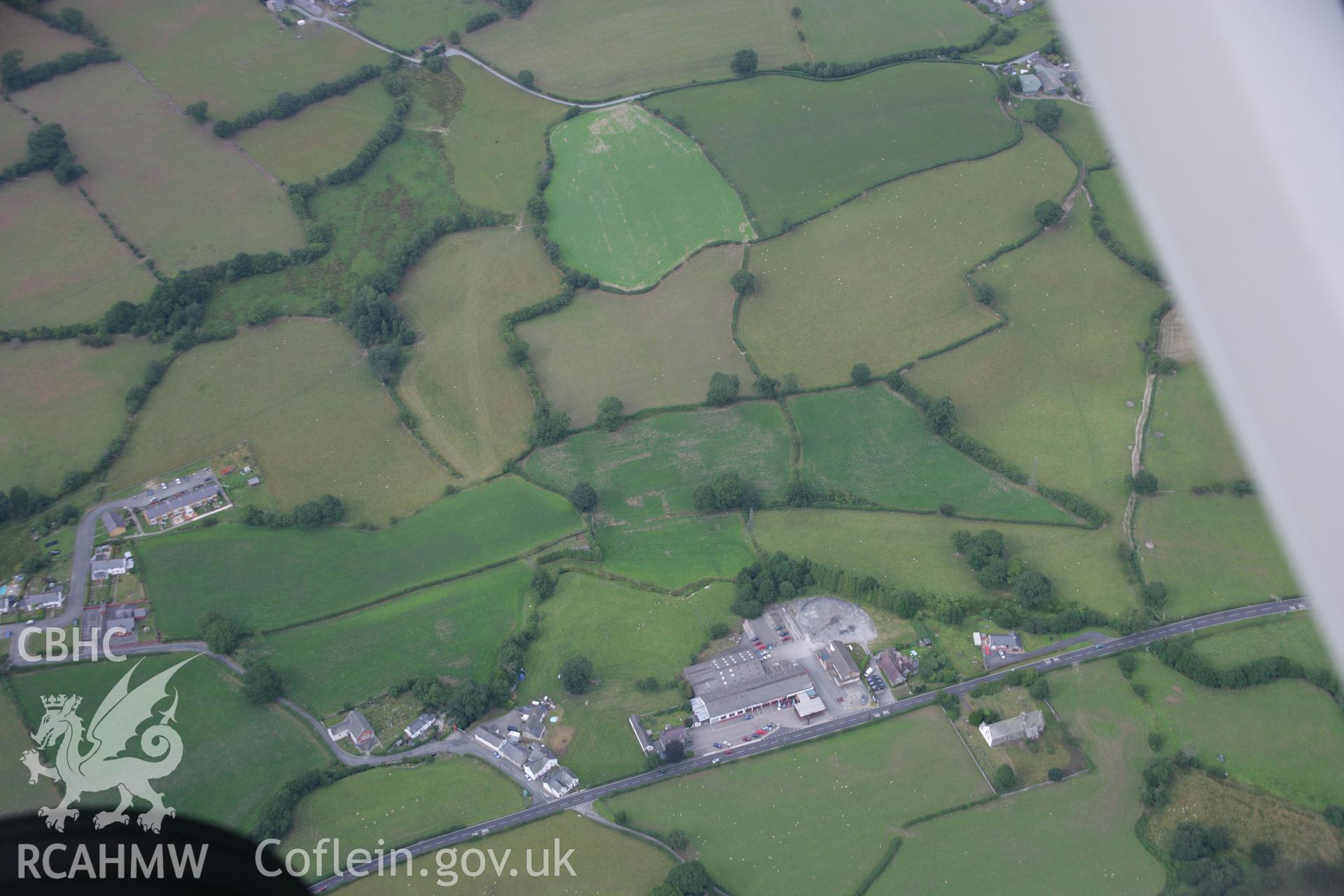RCAHMW colour oblique aerial photograph of St James' Church, showing uncertain cropmarks. Taken on 14 August 2006 by Toby Driver