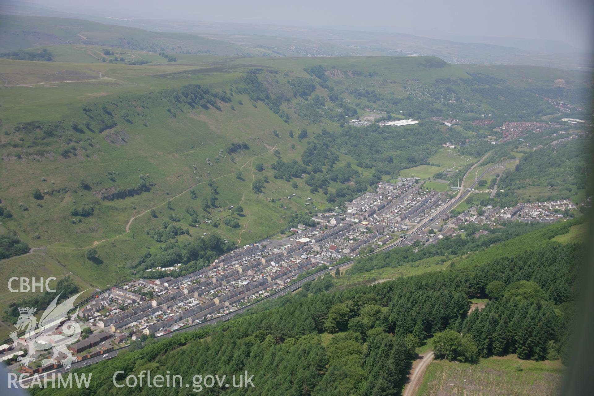 RCAHMW colour oblique aerial photograph of Cwm Village from the east. Taken on 09 June 2006 by Toby Driver.