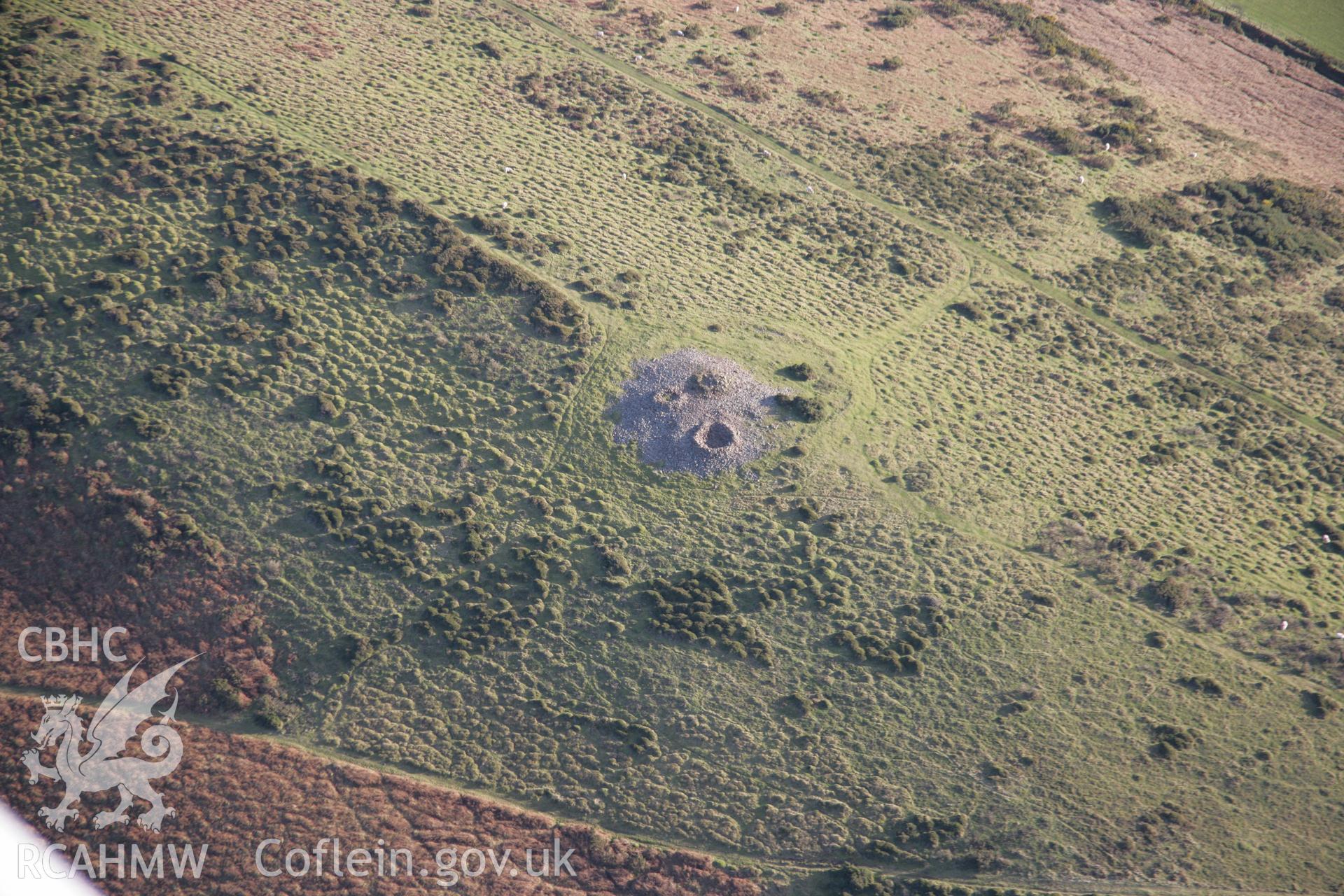 RCAHMW colour oblique aerial photograph of Llanmadoc Hill Cairn XII, viewed from the north-west Taken on 26 January 2006 by Toby Driver.