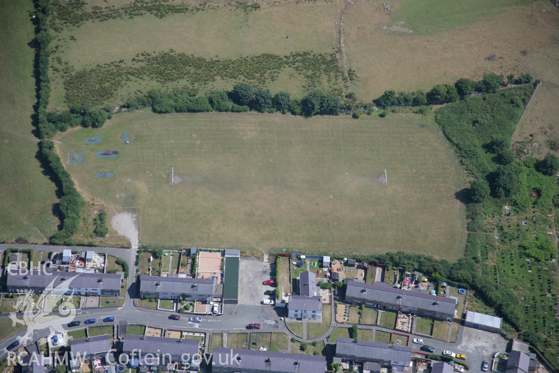 RCAHMW colour oblique aerial photograph of the Tyddyn Pandy Square Barrow Cemetery. Taken on 25 July 2006 by Toby Driver.
