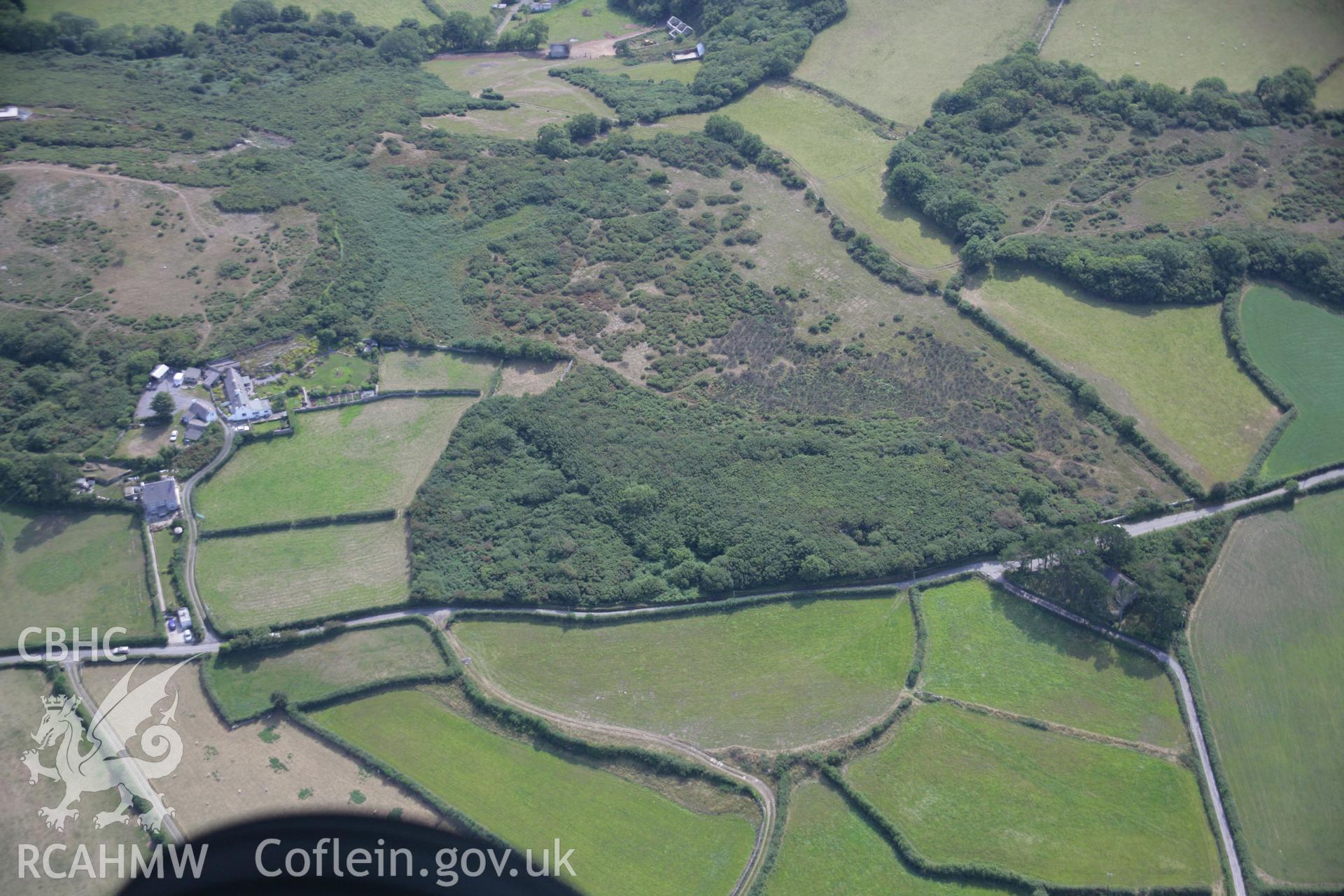RCAHMW colour oblique aerial photograph of the settlement complex west of Mariandyrys showing a curvilinear field to the east. Taken on 14 August 2006 by Toby Driver.