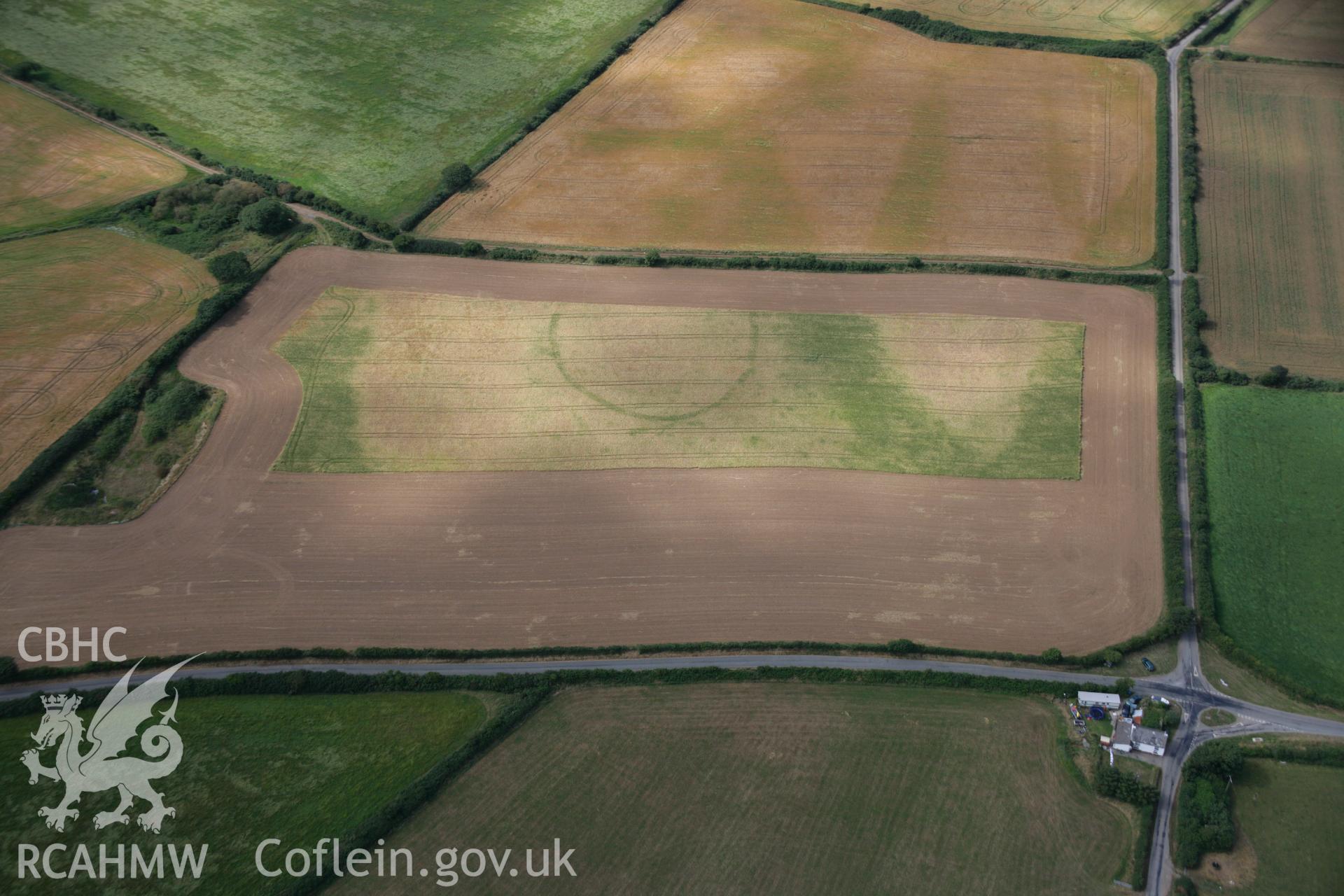 RCAHMW colour oblique aerial photograph of the Post-Coch cropmark enclosure northeast of Nevern. Taken on 27 July 2006 by Toby Driver.