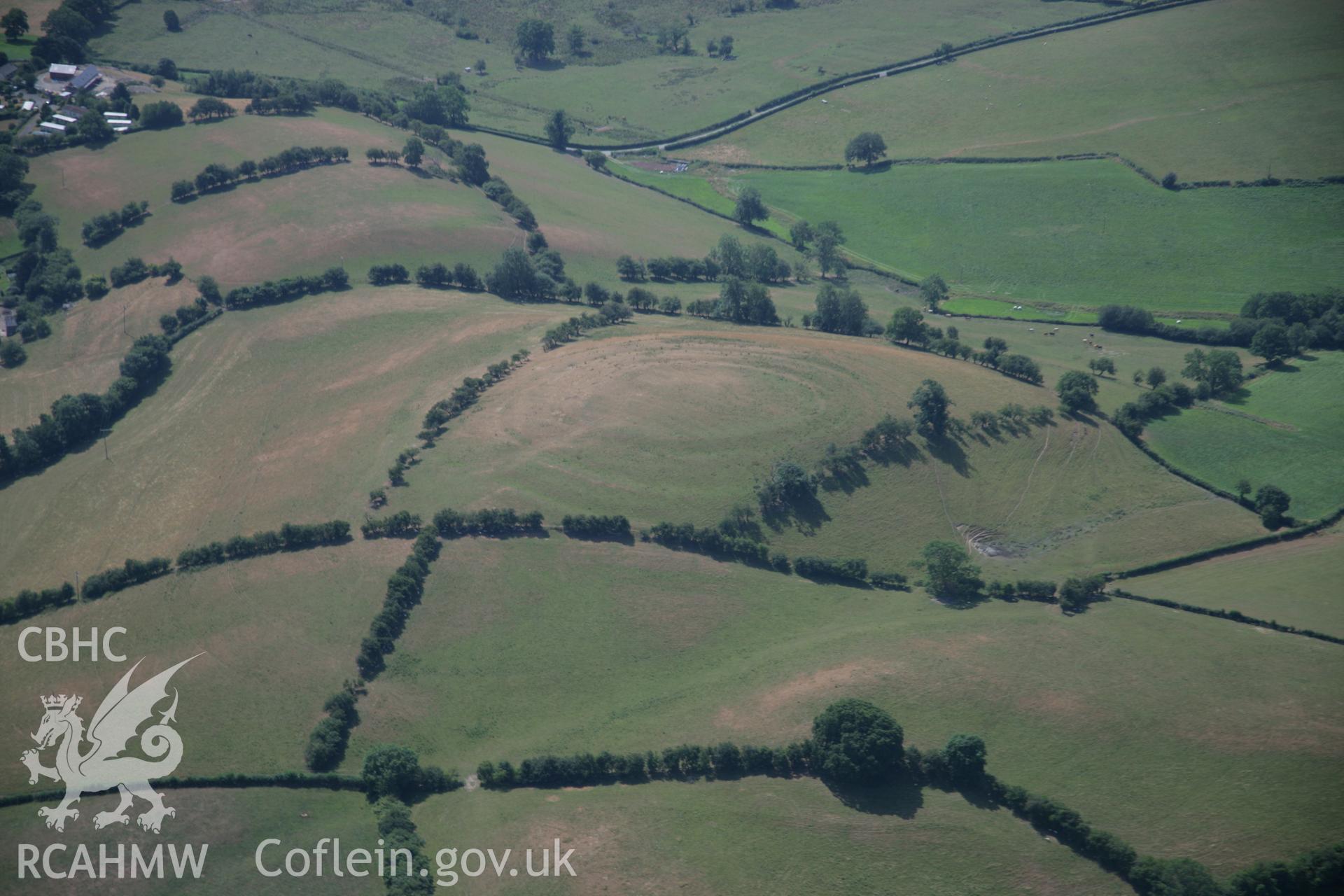 RCAHMW colour oblique aerial photograph of Pentre Camp, Pen-y-Gorddin Defended Enclosure. Taken on 25 July 2006 by Toby Driver.