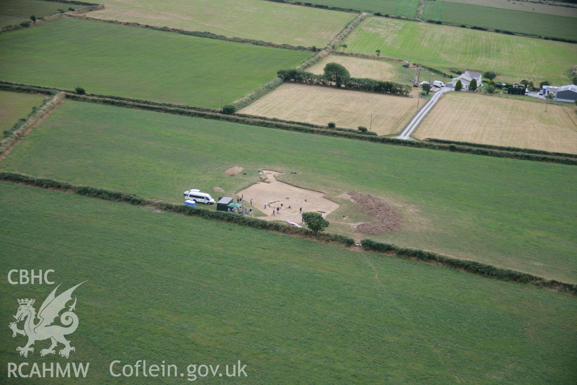 RCAHMW colour oblique aerial photograph of Ffynnonwen Defended Enclosure during excavations by the Dyfed Archaeological Trust. Taken on 27 July 2006 by Toby Driver.