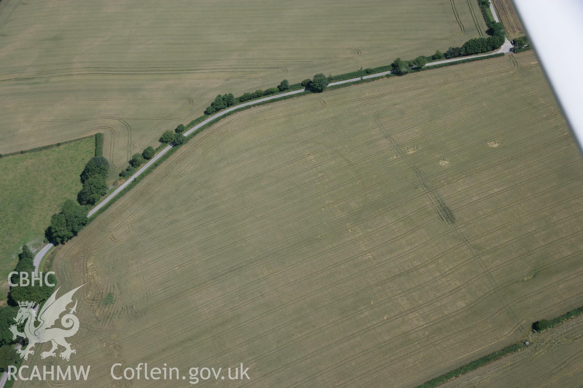 RCAHMW colour oblique aerial photograph of Cawrence Cropmark Enclosure. Taken on 14 July 2006 by Toby Driver.