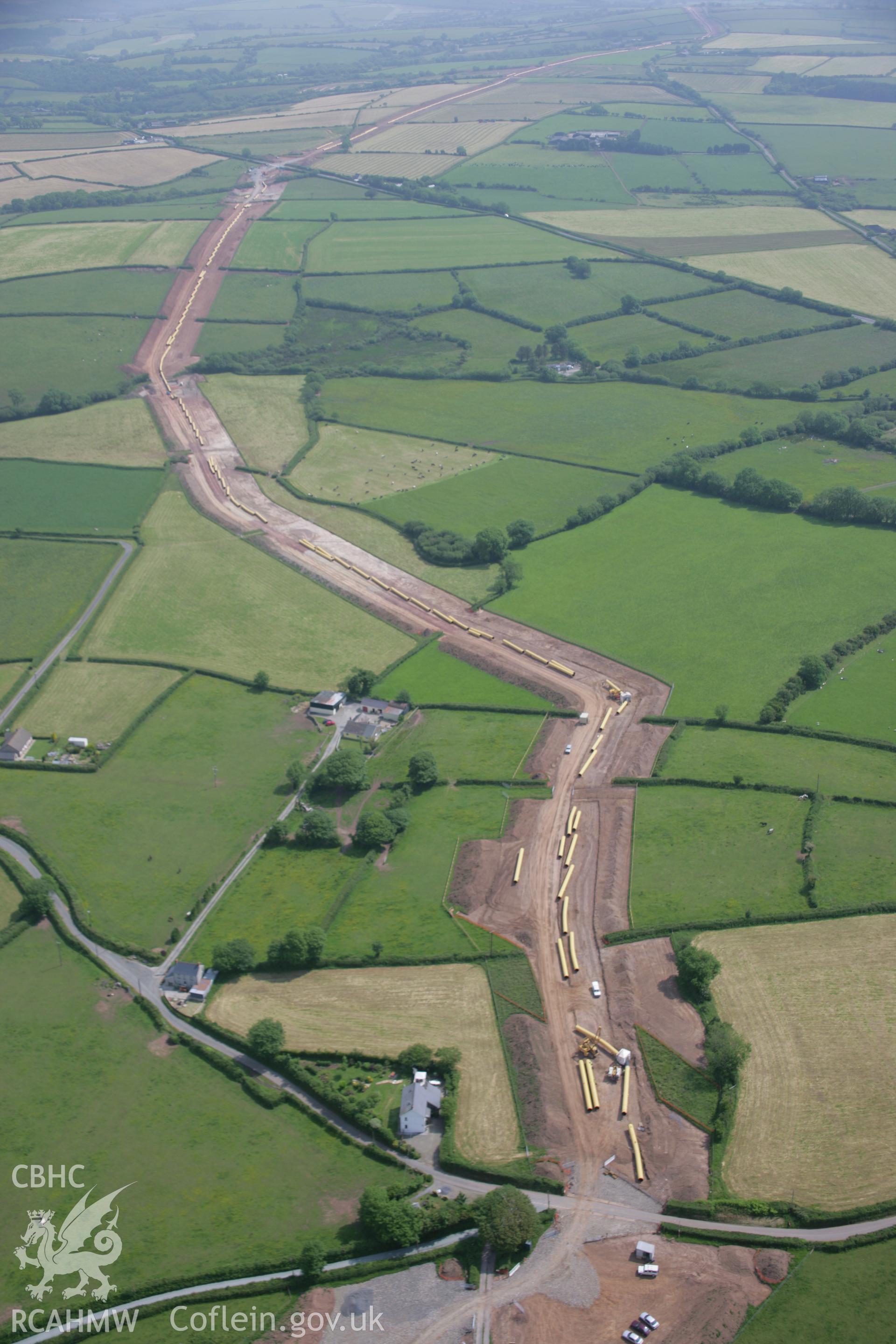 RCAHMW colour oblique aerial photograph of LNG Natural Gas Pipeline, Tavernspite, viewed looking to the east. Taken on 15 June 2006 by Toby Driver.
