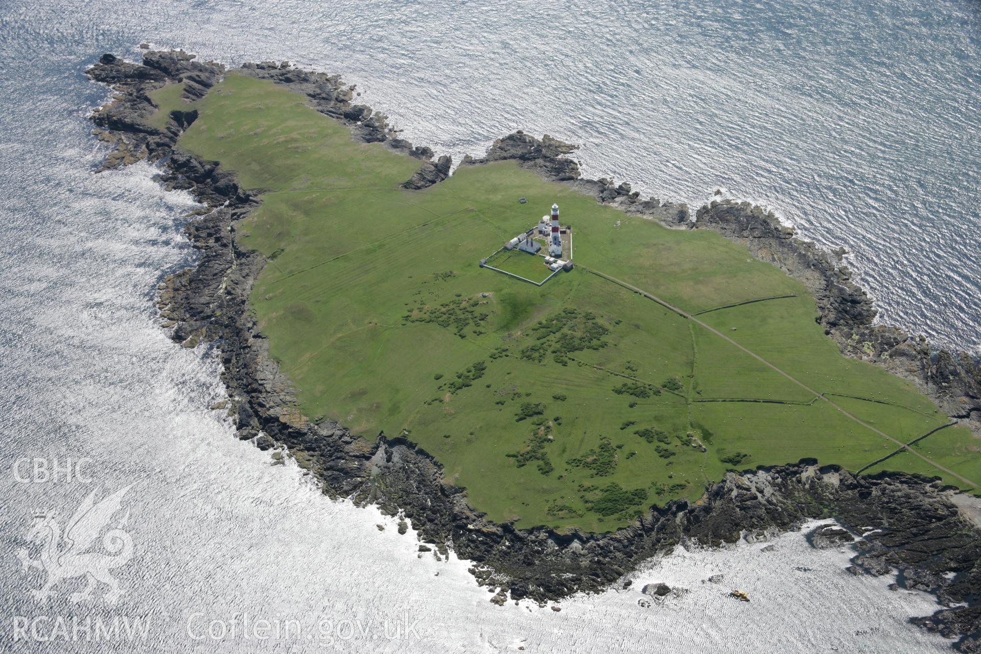 RCAHMW colour oblique aerial photograph of Bardsey Island Lighthouse from the north-east. Taken on 14 June 2006 by Toby Driver.