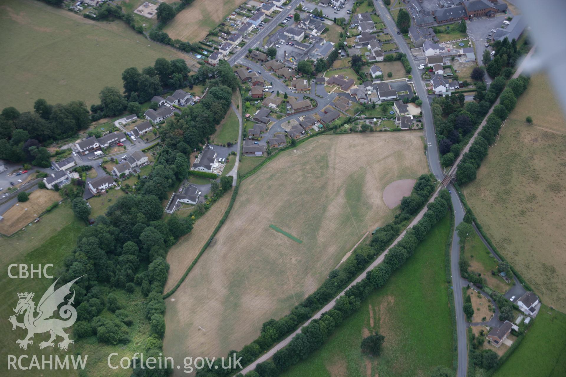 RCAHMW colour oblique aerial photograph of uncertain cropmarks to west of Llandovery Roman Fort. Taken on 27 July 2006 by Toby Driver.