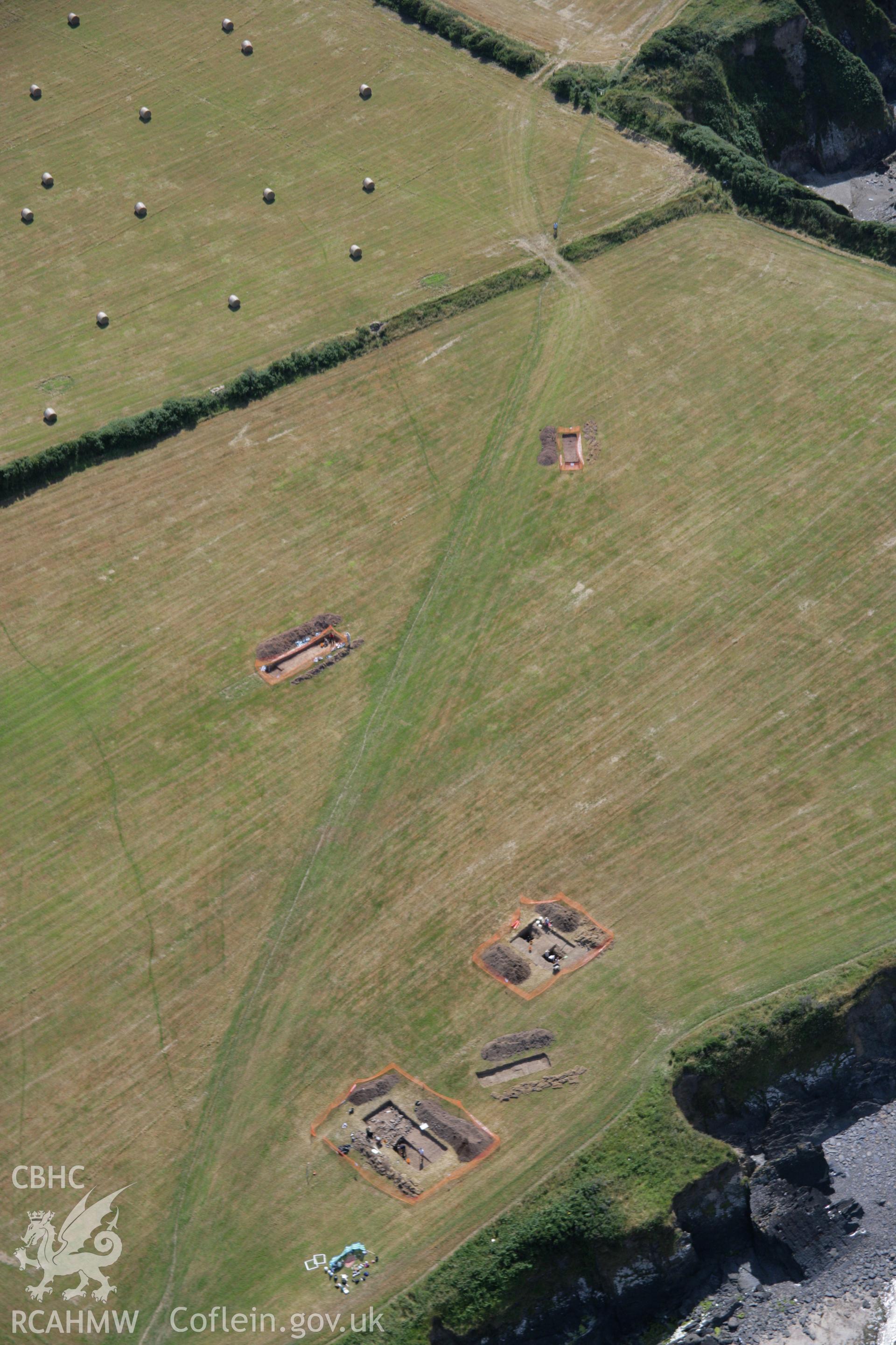 RCAHMW colour oblique aerial photograph of West Angle Bay Cemetery and Enclosure showing excavations. Taken on 24 July 2006 by Toby Driver.