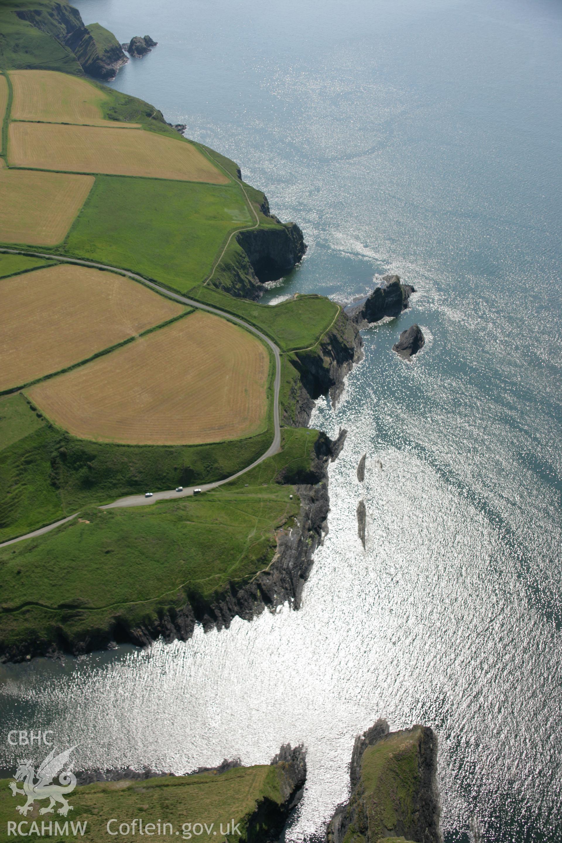 RCAHMW colour oblique aerial photograph of the Pembrokeshire Coast Path between Ceibwr Bay and Foel Hendre. A landscape view looking south-west. Taken on 08 June 2006 by Toby Driver.