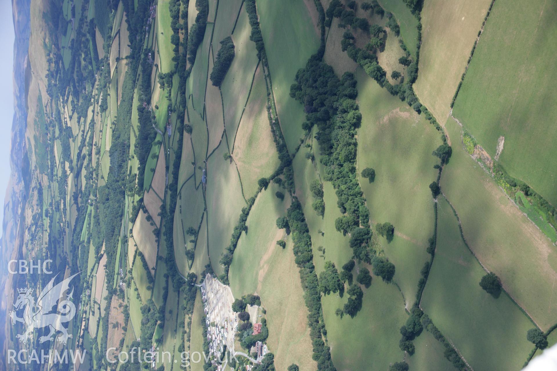 RCAHMW colour oblique aerial photograph of parchmarks showing Penmincae to Caerwnon Roman Road. Taken on 27 July 2006 by Toby Driver.