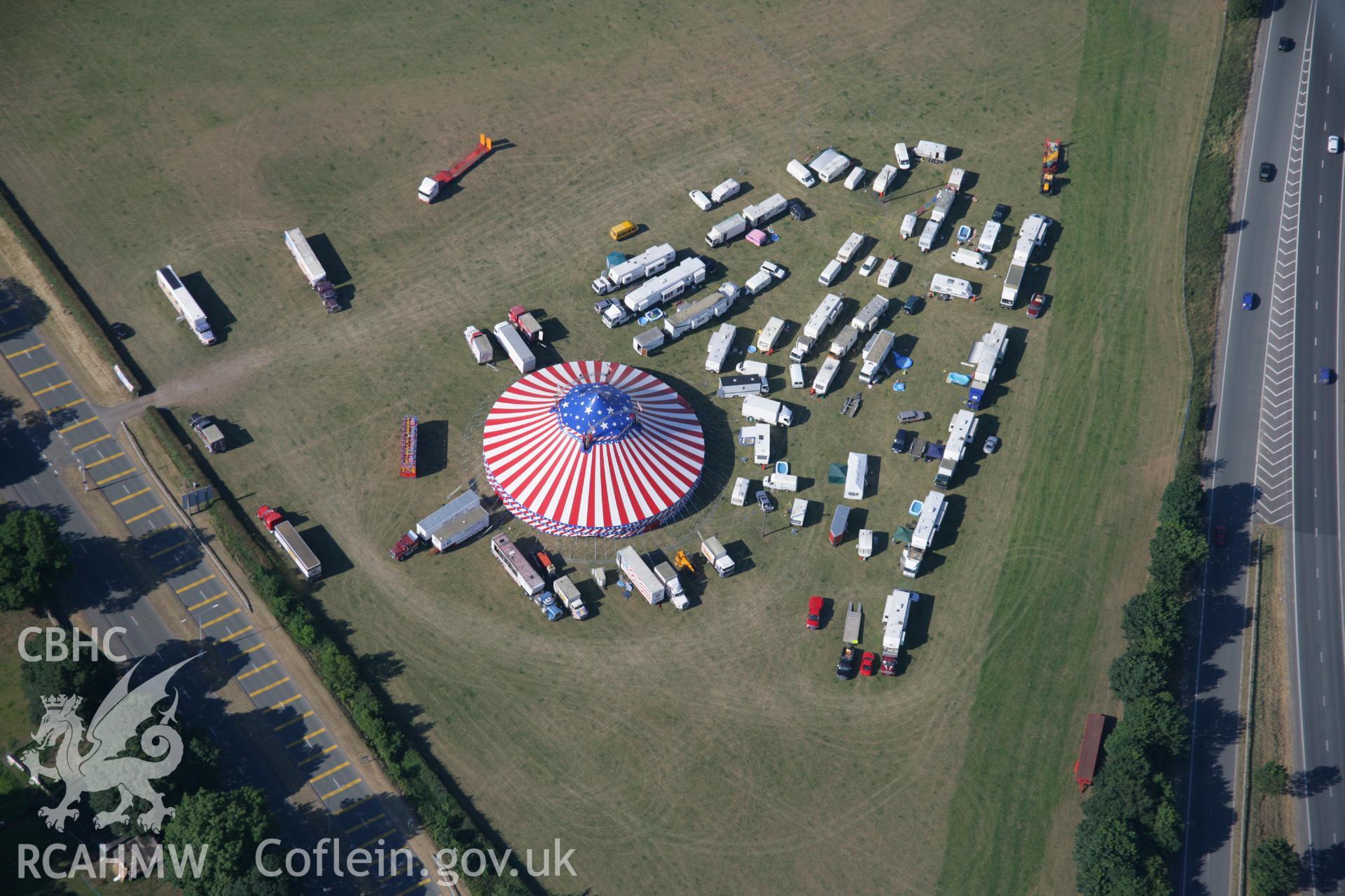 RCAHMW colour oblique aerial photograph of Wrexham showing the American fair. Taken on 17 July 2006 by Toby Driver.