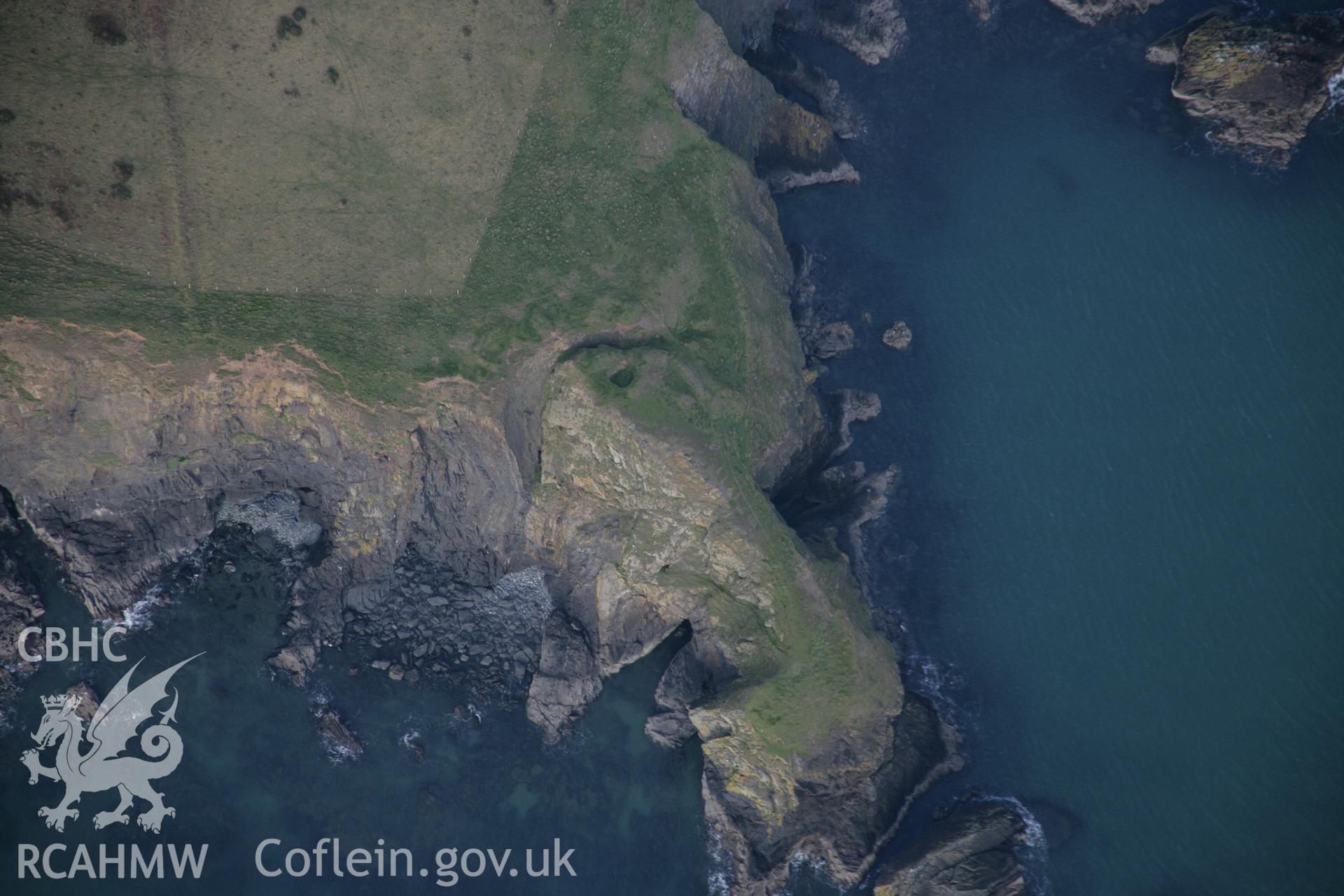 RCAHMW colour oblique aerial photograph of Trwyn Gwningaer from the south. Taken on 09 February 2006 by Toby Driver.