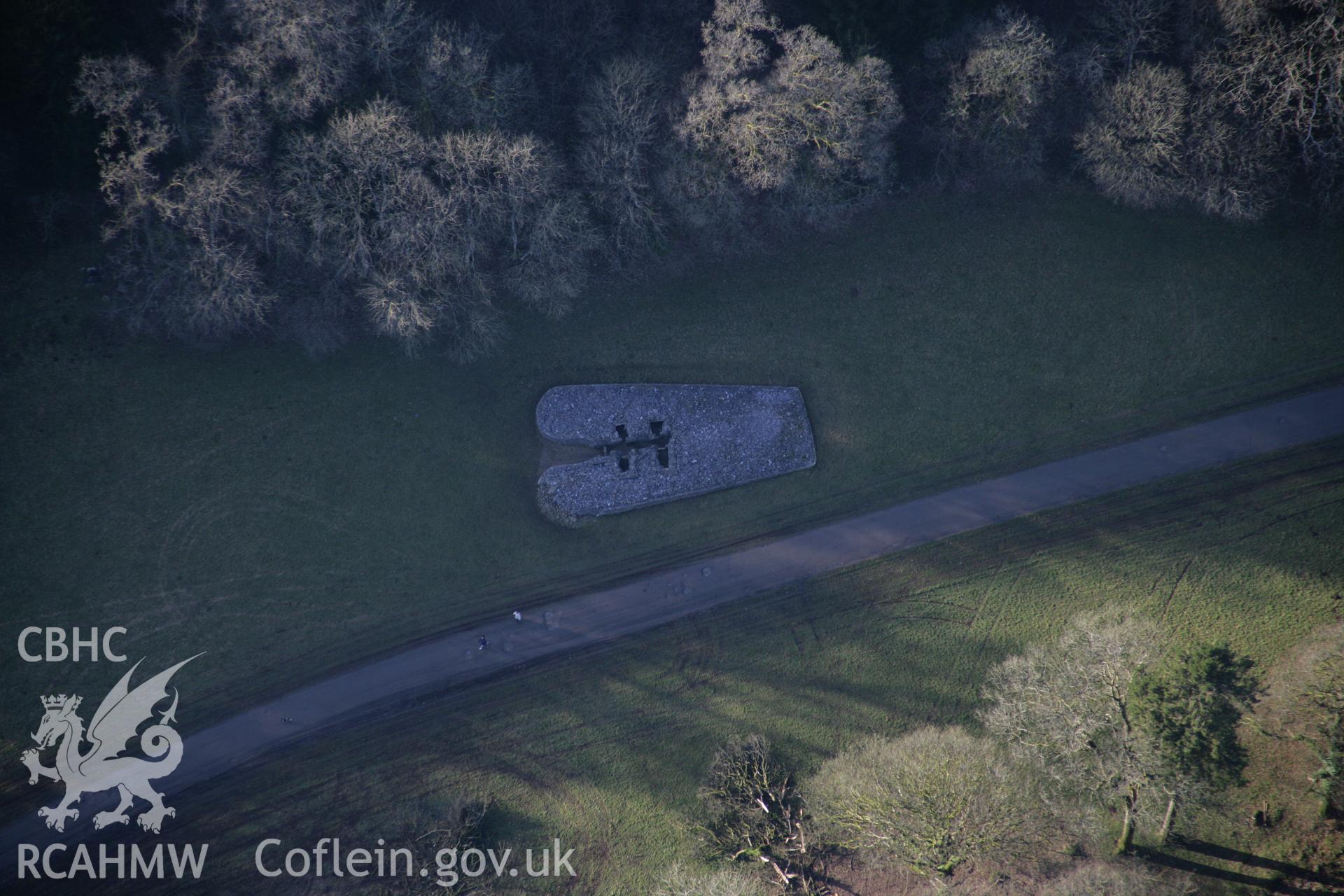 RCAHMW colour oblique aerial photograph of Parc Le Breos Burial Chamber, chambered cairn, viewed from the east. Taken on 26 January 2006 by Toby Driver.