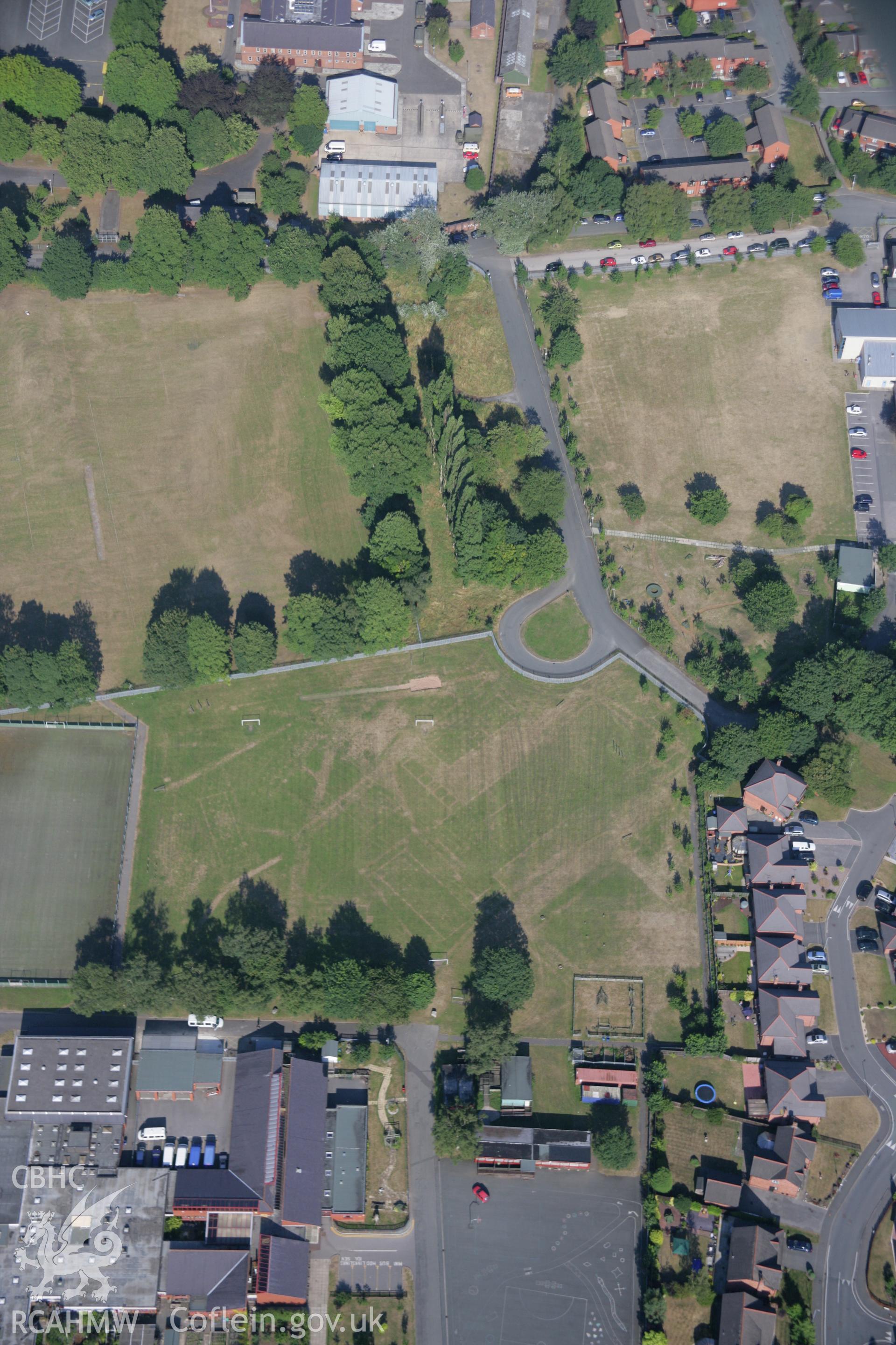 RCAHMW colour oblique aerial photograph of cropmarks of Former Barracks at Hightown. Taken on 17 July 2006 by Toby Driver.