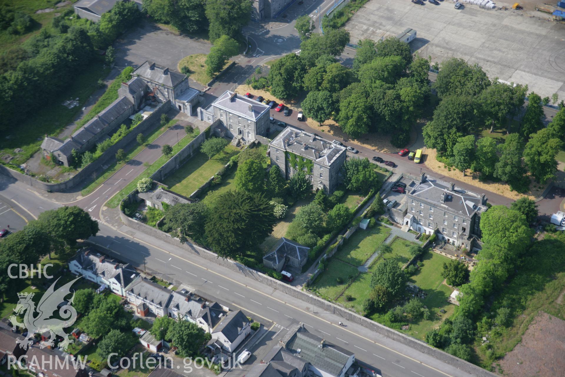 RCAHMW colour oblique aerial photograph of the dockyard gates at Pembroke Dock from the south-east. Taken on 08 June 2006 by Toby Driver.