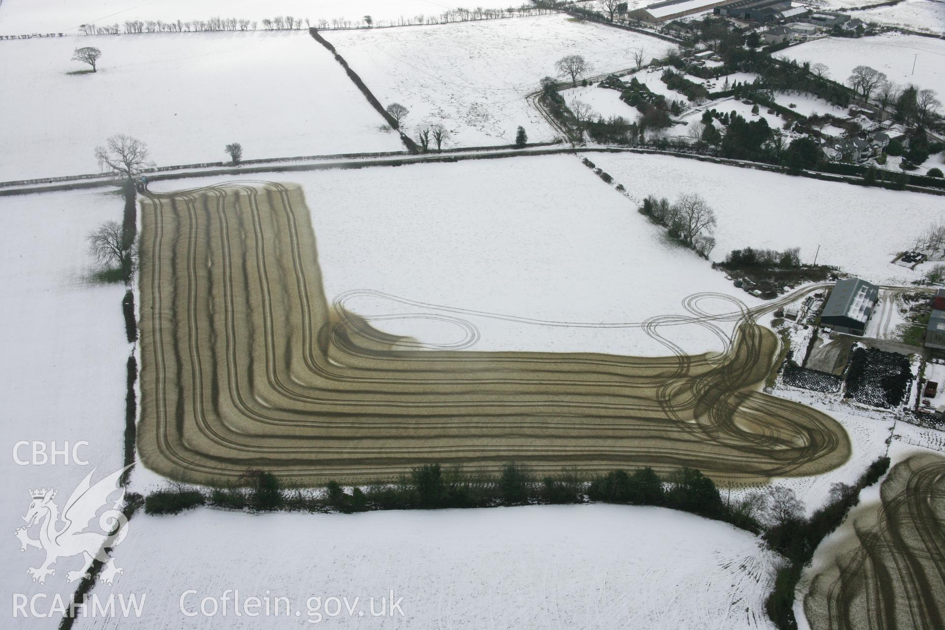 RCAHMW colour oblique aerial photograph of Llidiart-Fawr Farm, with slurry spreading on winter fields Taken on 06 March 2006 by Toby Driver.