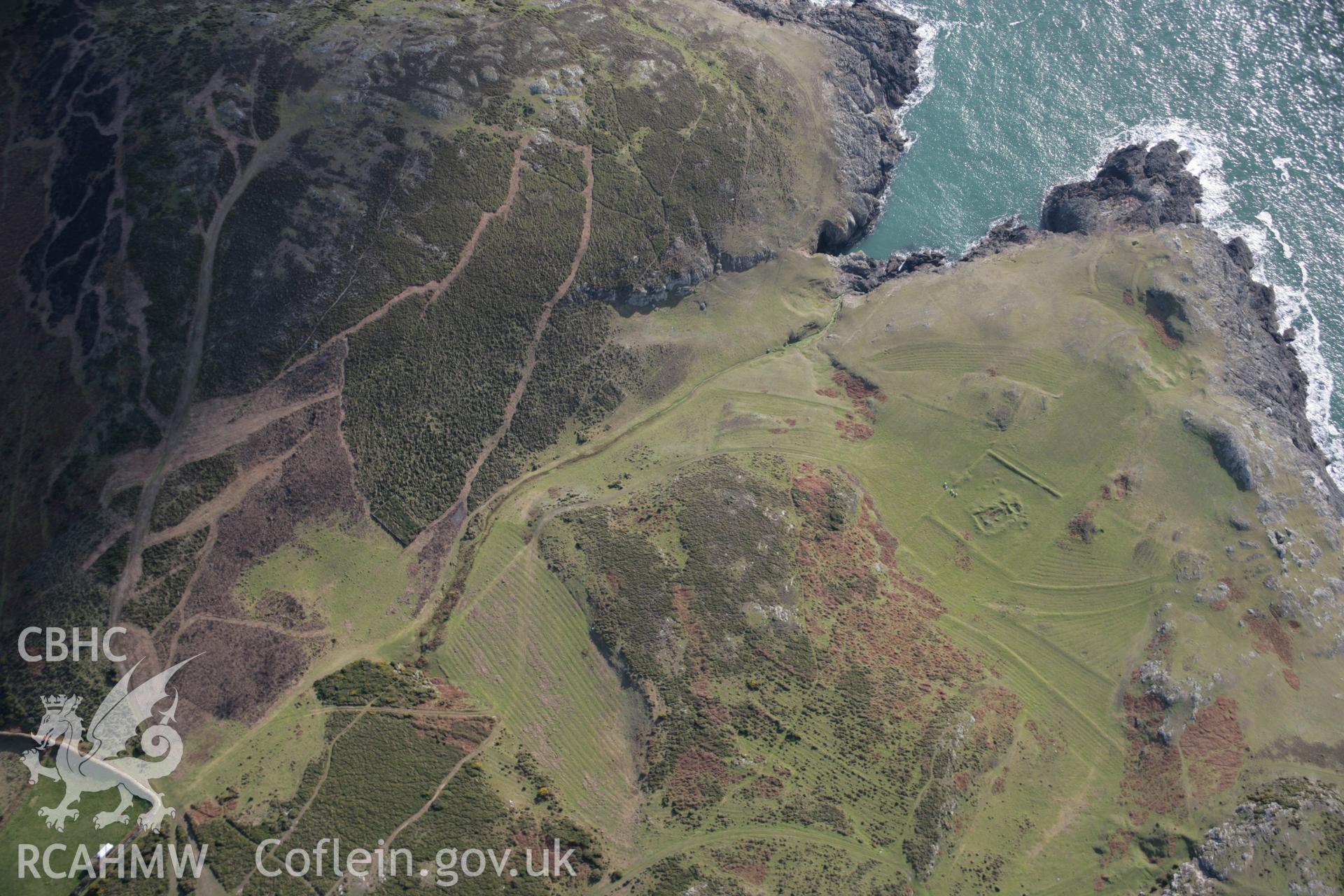 RCAHMW colour oblique aerial photograph of St Marys Church earthworks, viewed from the north. Taken on 09 February 2006 by Toby Driver