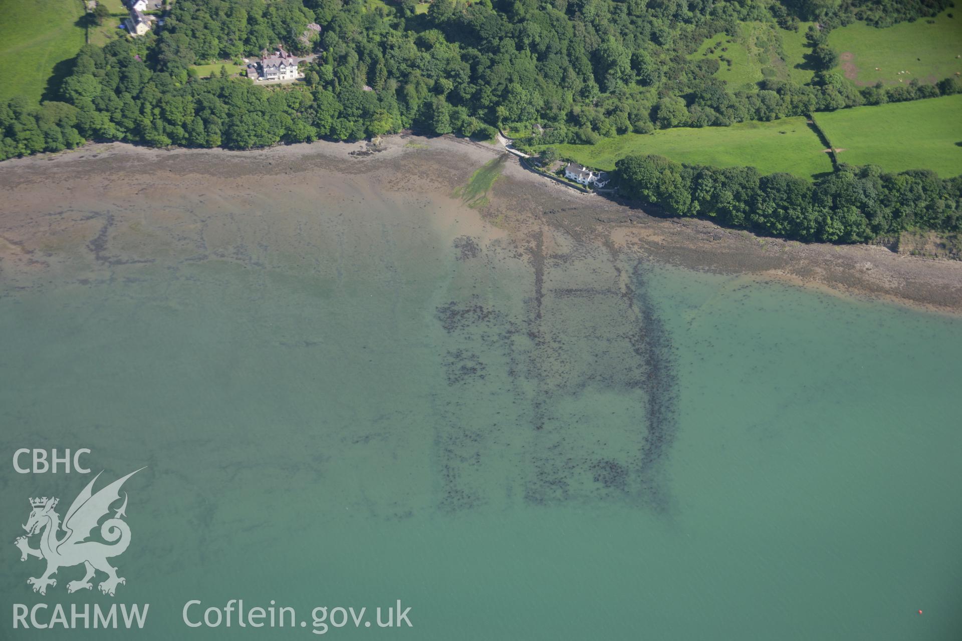 RCAHMW colour oblique aerial photograph of Gorad Ddu Fish Weir from the north-west. Taken on 14 June 2006 by Toby Driver.