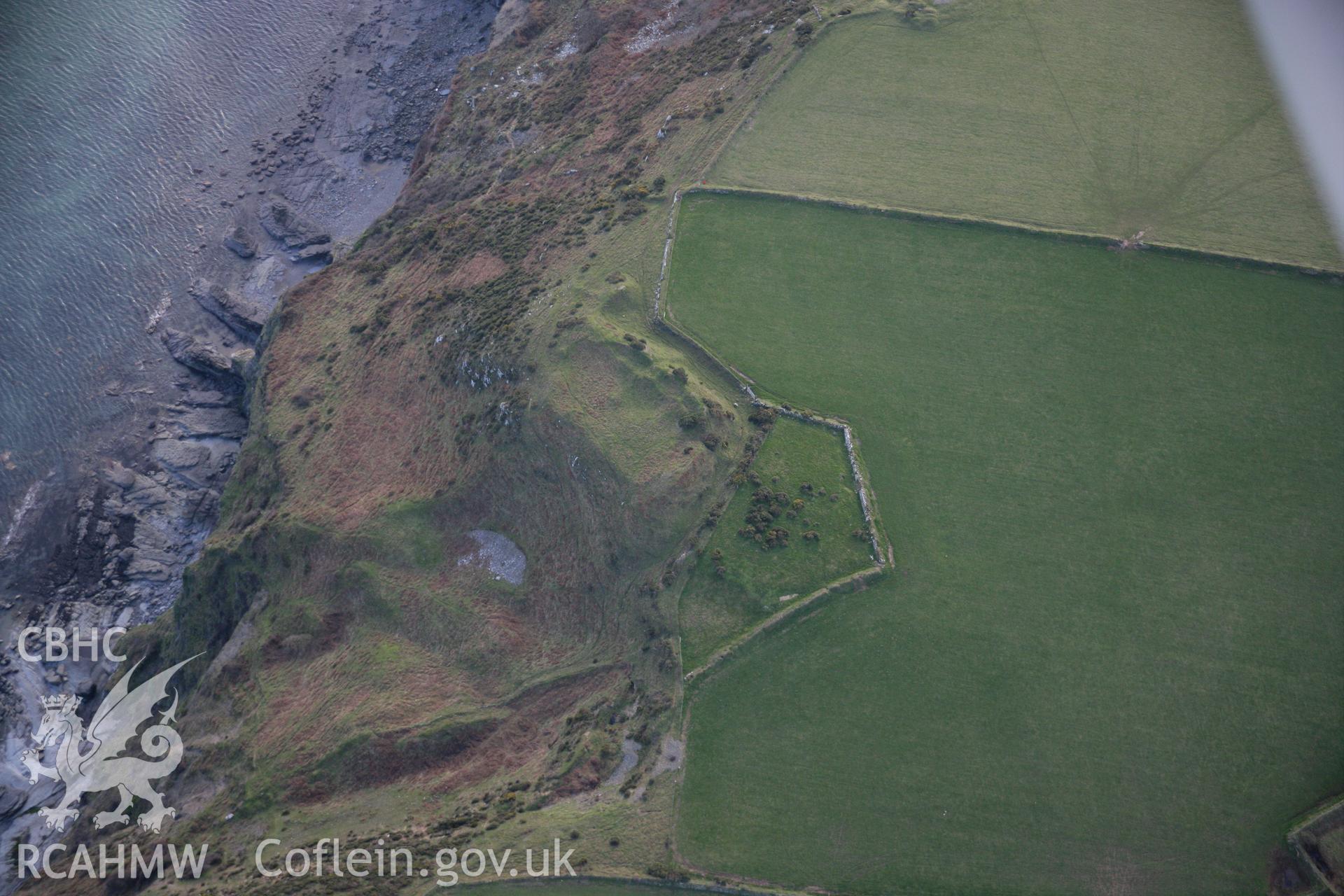 RCAHMW colour oblique aerial photograph of Pared Mawr Camp with promontory fort, Porth Ceiriad, viewed from the north. Taken on 09 February 2006 by Toby Driver.