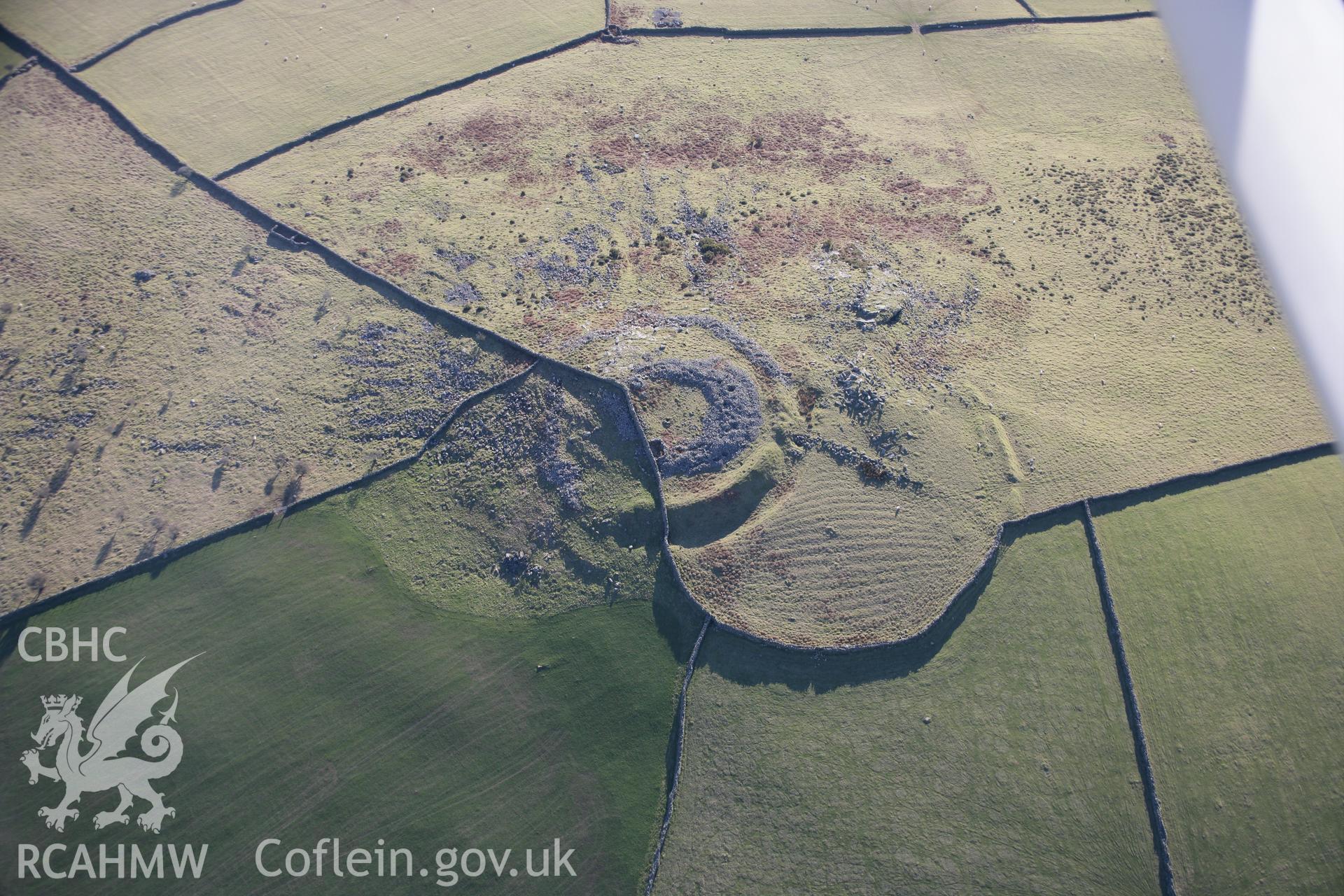RCAHMW colour oblique aerial photograph of Carn Pentyrch Hillfort from the north. Taken on 09 February 2006 by Toby Driver.