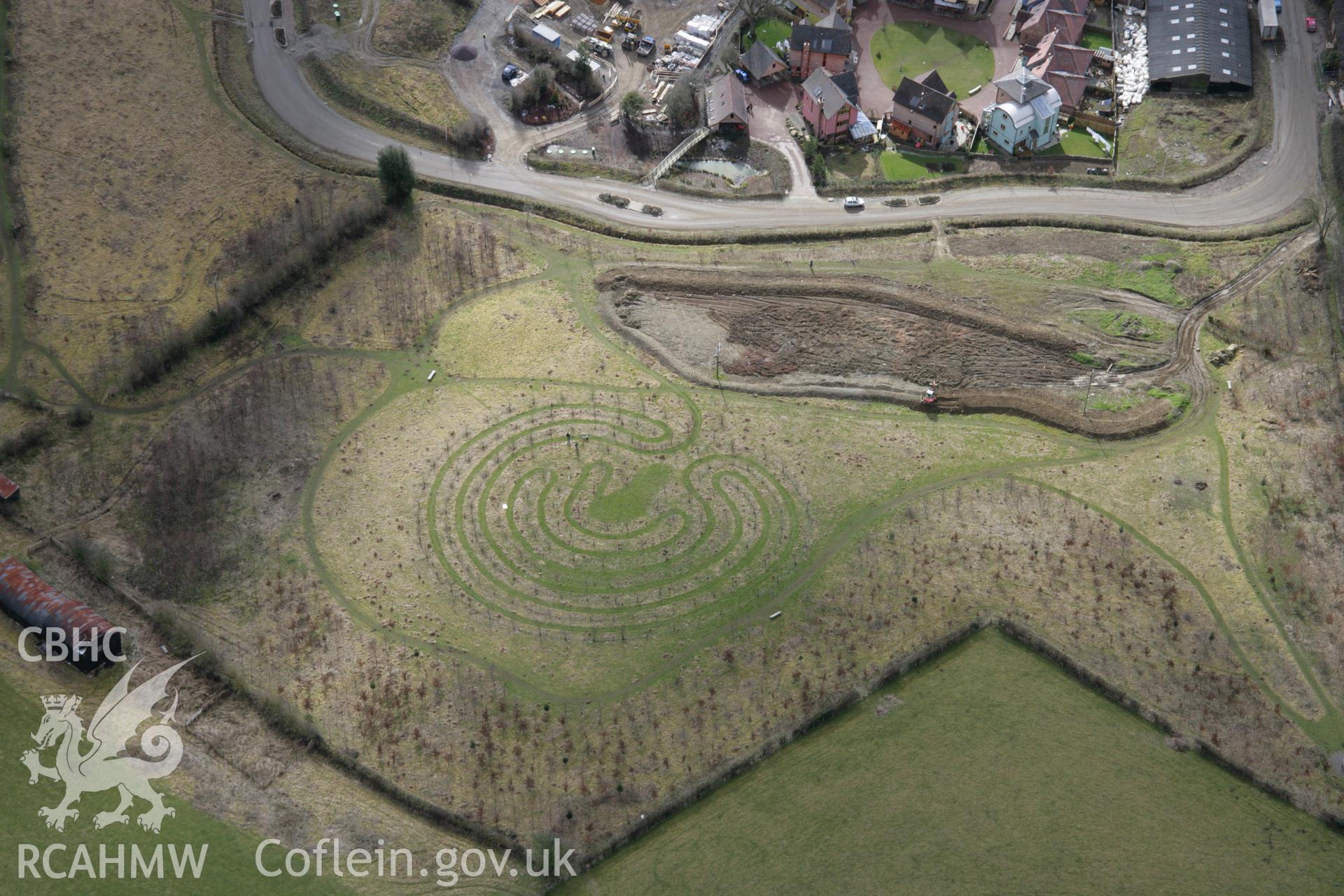 RCAHMW colour oblique aerial photograph of Bishops Castle and a maze from the north. Taken on 06 March 2006 by Toby Driver.