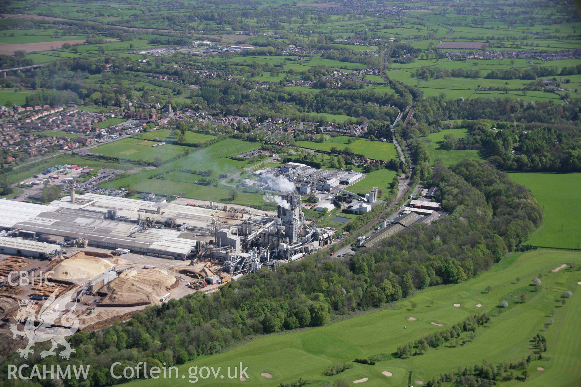 RCAHMW digital colour oblique photograph of the woodchip factory in Chirk from the north-west. Taken on 05/05/2006 by T.G. Driver.