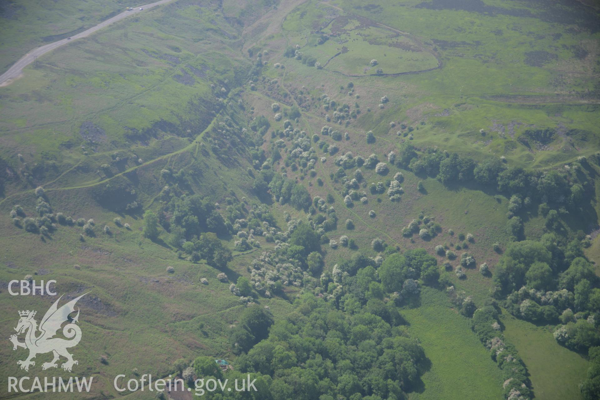 RCAHMW colour oblique aerial photograph of Garnddyrys Ironworks Tramway (Hill's Tramroad), and The Tumble, from the north. Taken on 09 June 2006 by Toby Driver.