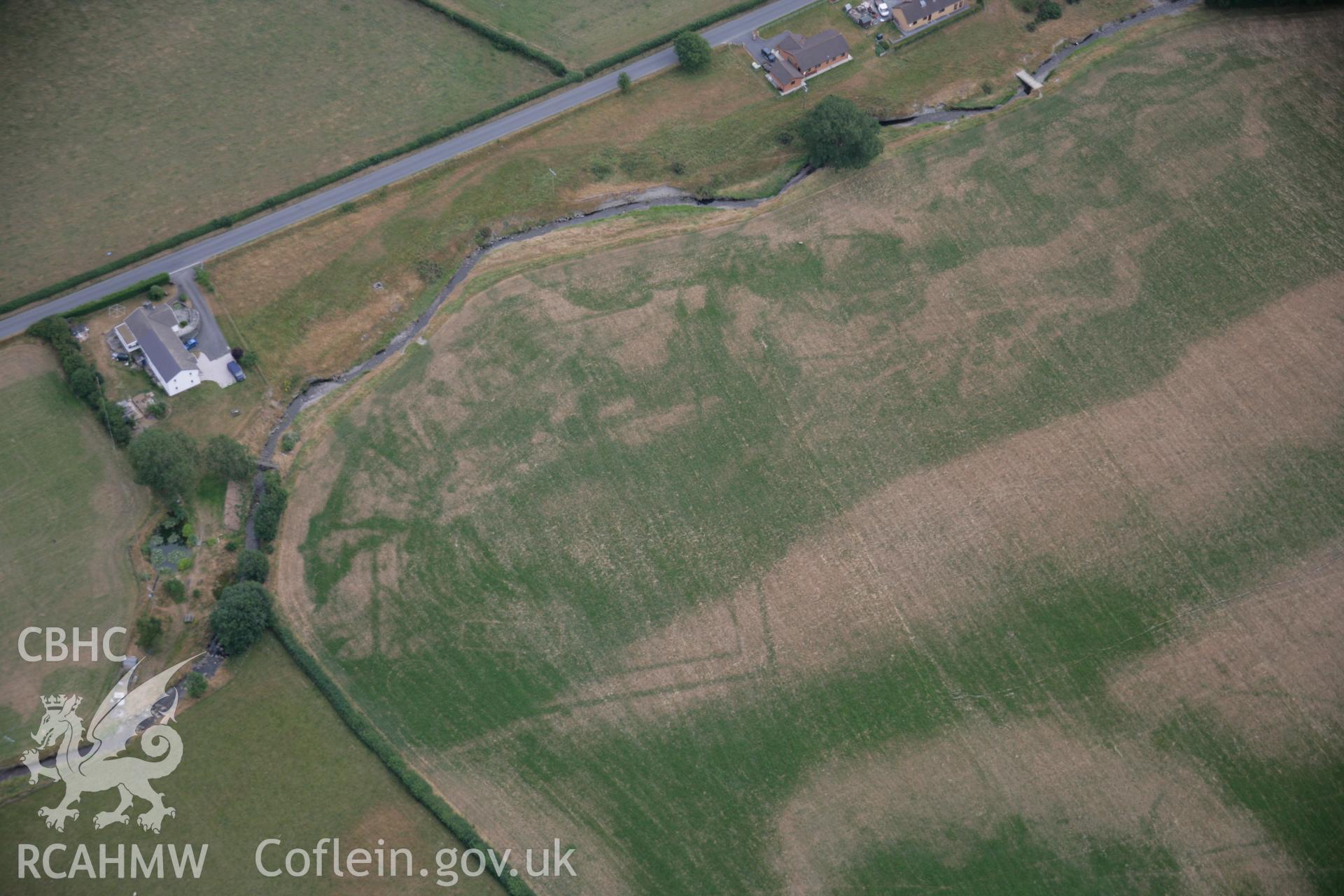 RCAHMW colour oblique aerial photograph of Nant Magwr Roman site, cropmarks from the north-east, by Toby Driver, 27/07/2006.