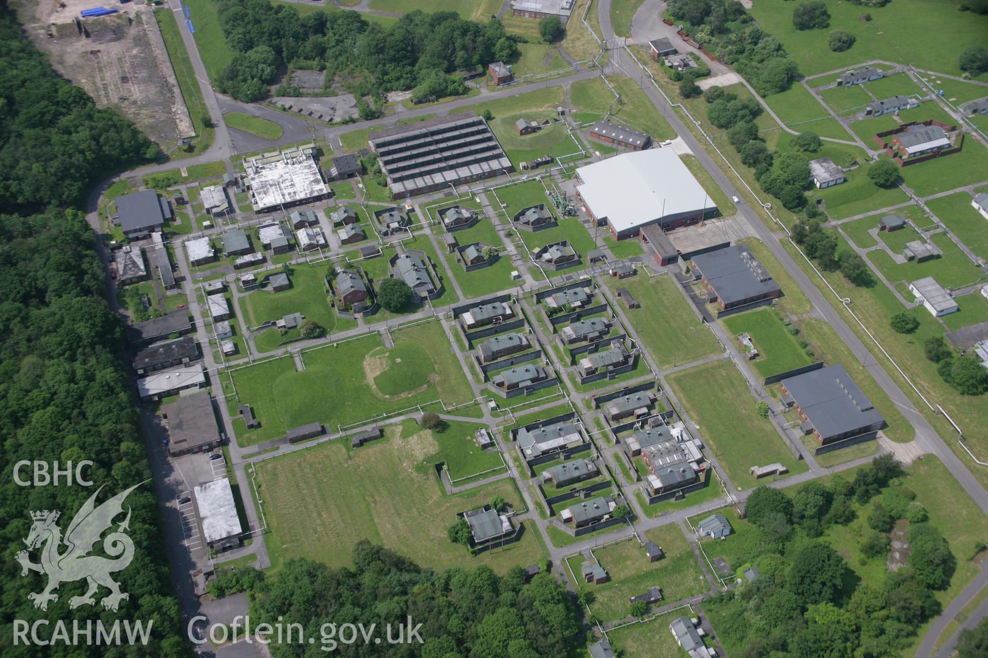 RCAHMW colour oblique aerial photograph of Glascoed Royal Ordnance Factory from the east. Taken on 09 June 2006 by Toby Driver.