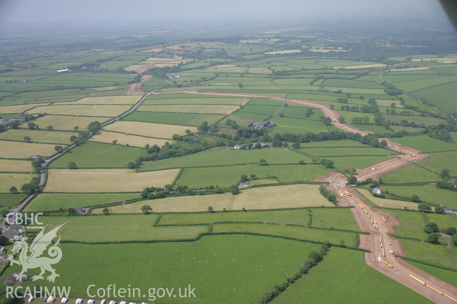 RCAHMW colour oblique aerial photograph of LNG Natural Gas Pipeline, Tavernspite, viewed looking to the west. Taken on 15 June 2006 by Toby Driver.
