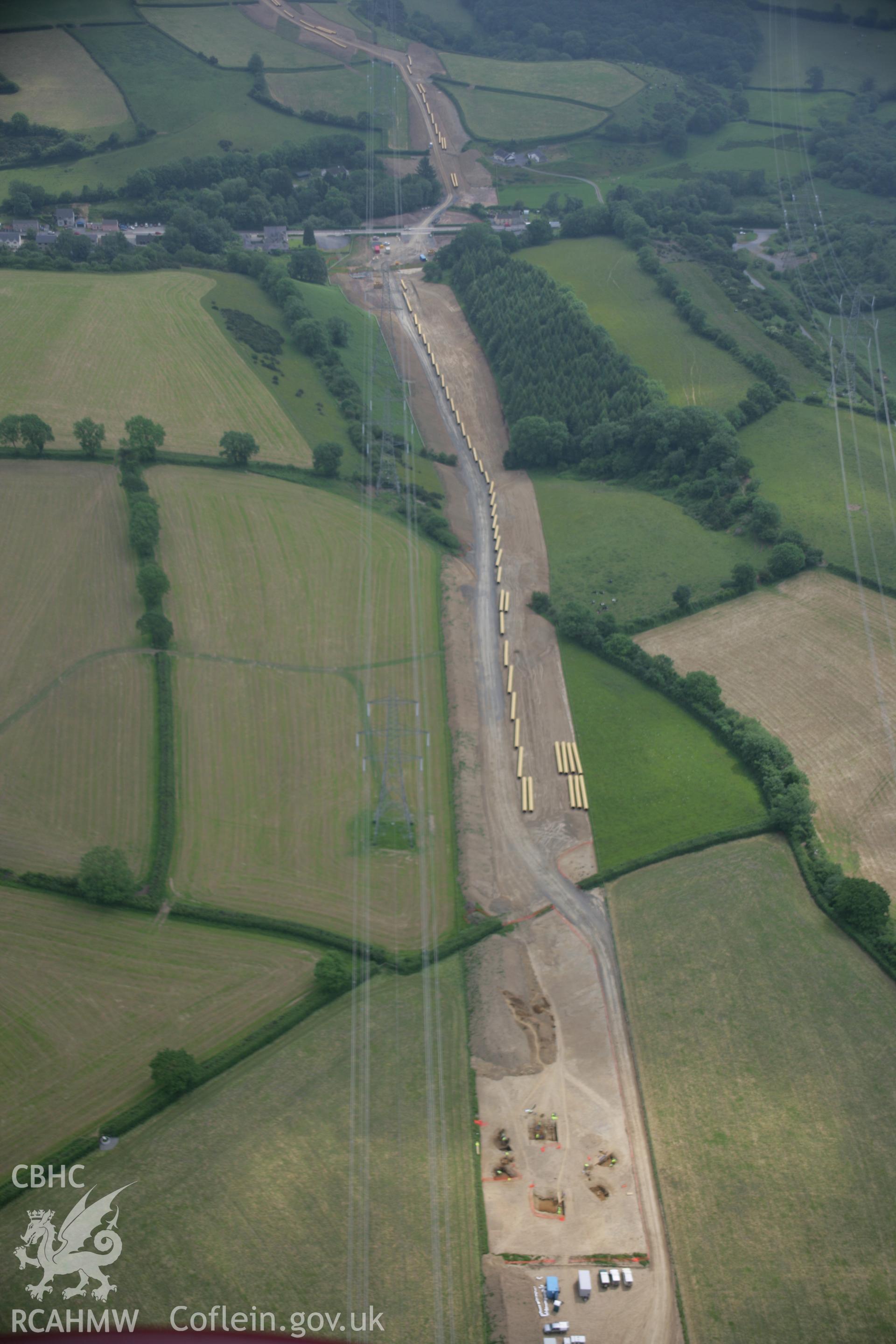 RCAHMW colour oblique aerial photograph of Vaynor Farm Henge showing excavations. A high view looking east. Taken on 15 June 2006 by Toby Driver.